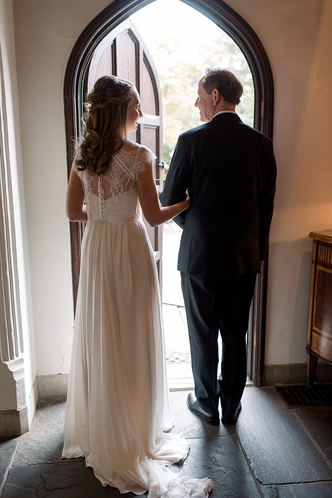 bride stands with father in doorway at Aldie Mansion
