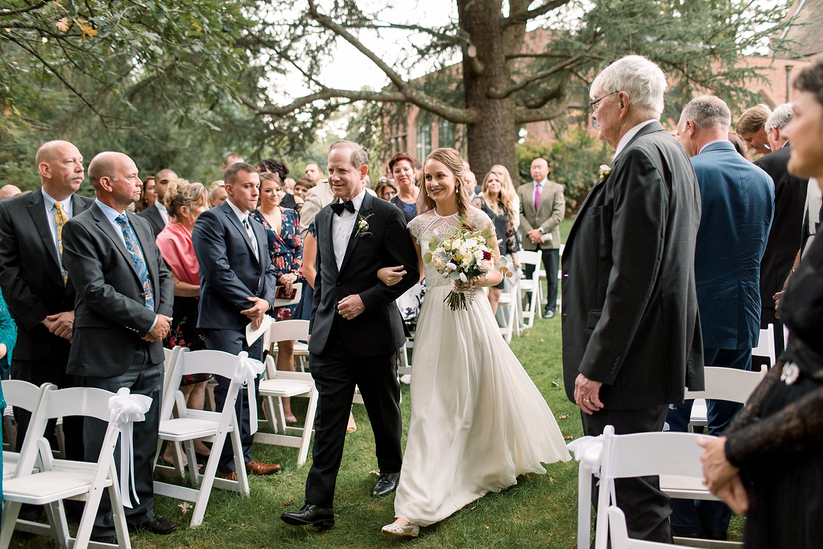 bride and father walk down aisle at Aldie Mansion