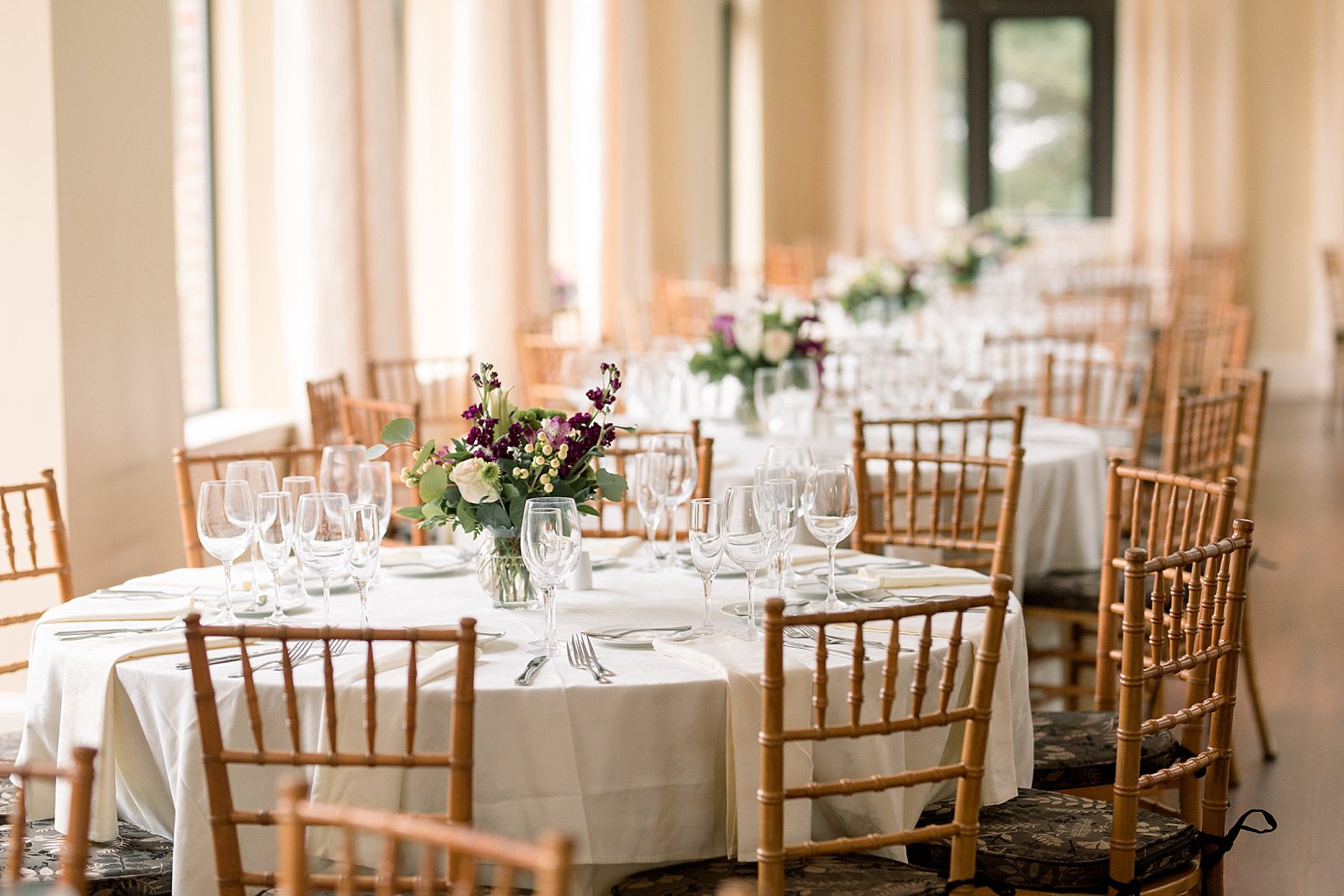 Aldie Mansion wedding reception with purple floral centerpieces 