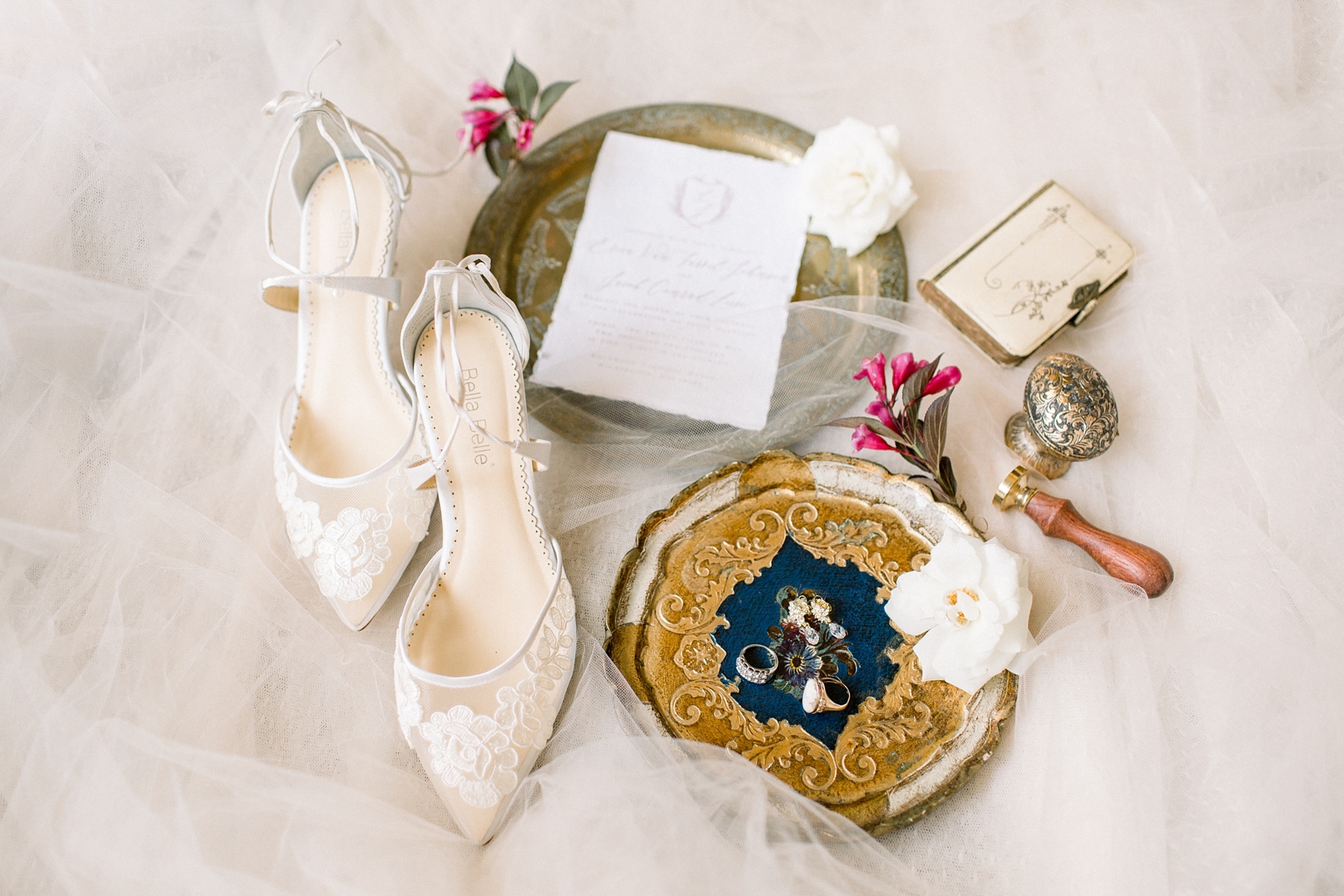 bride's ivory shoes with gold trays and jewelry at The Carriage House at Rockwood Park