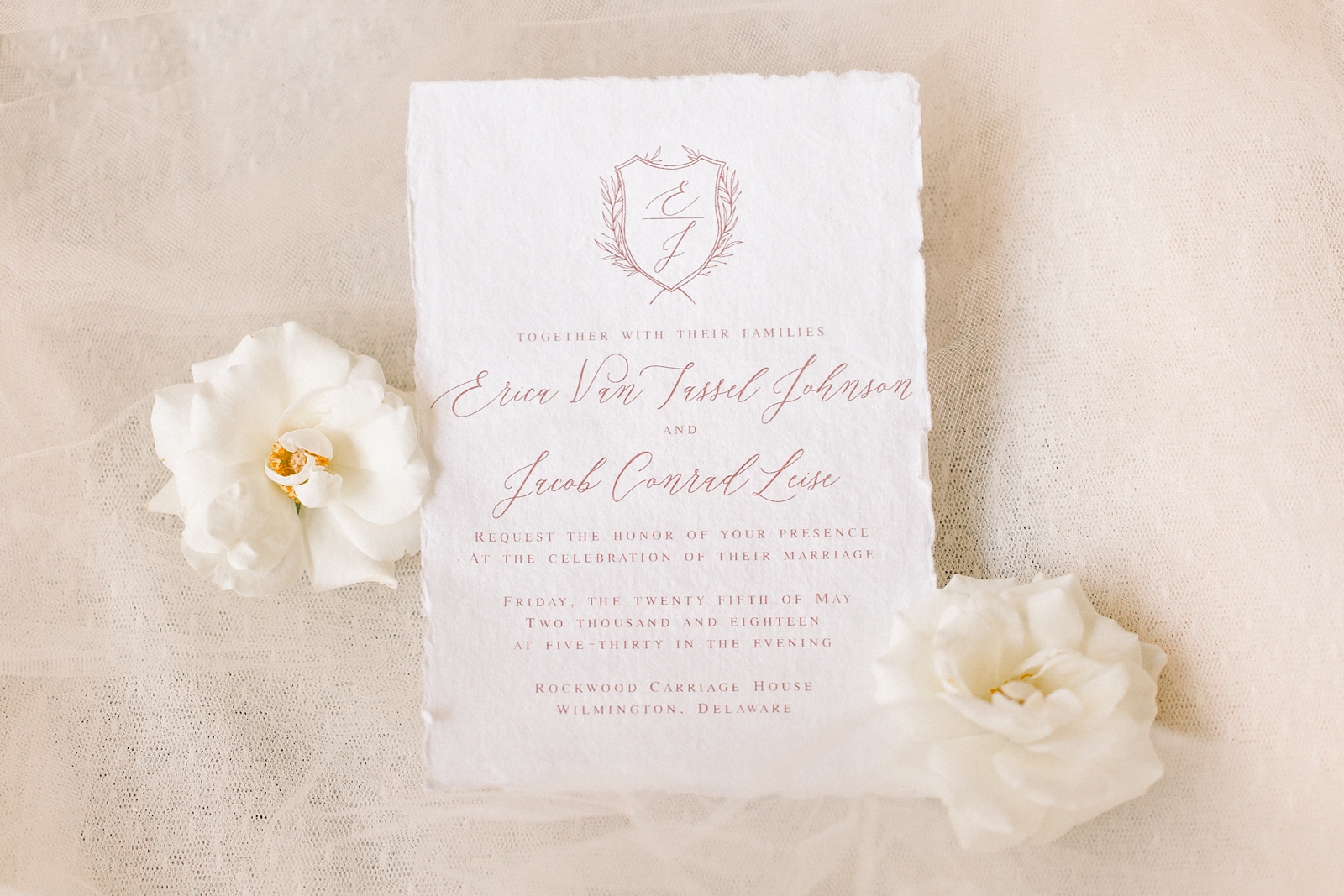 elegant wedding invitation with pink script 