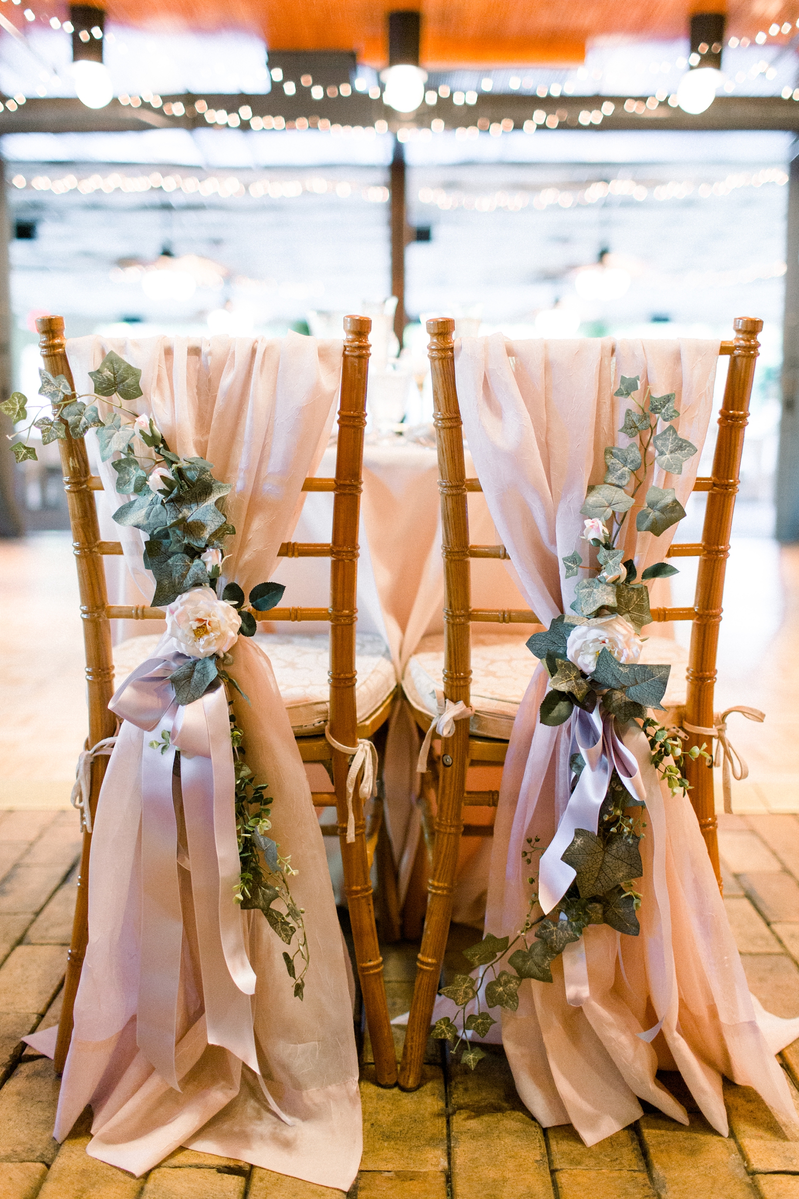 The Carriage House at Rockwood Park wedding reception with blush fabric and pink roses 