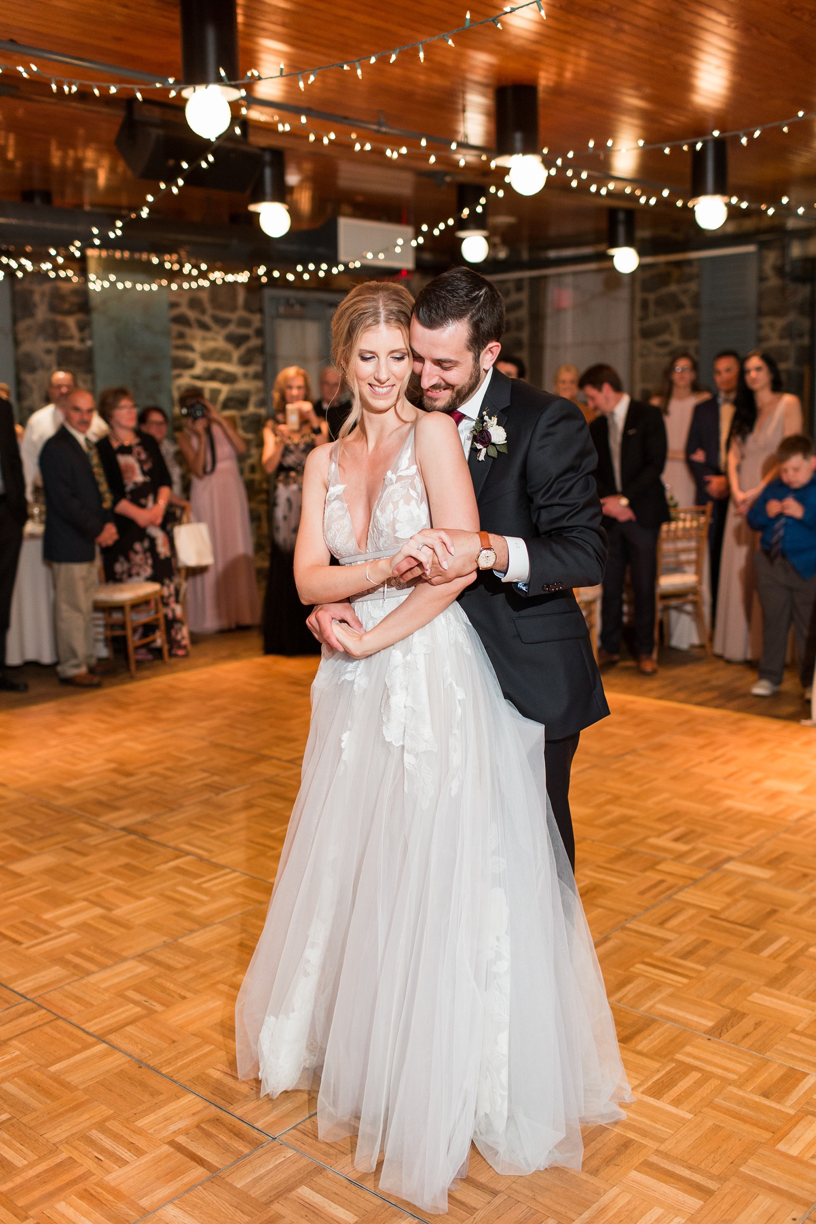 bride and groom dance during The Carriage House at Rockwood Park wedding reception