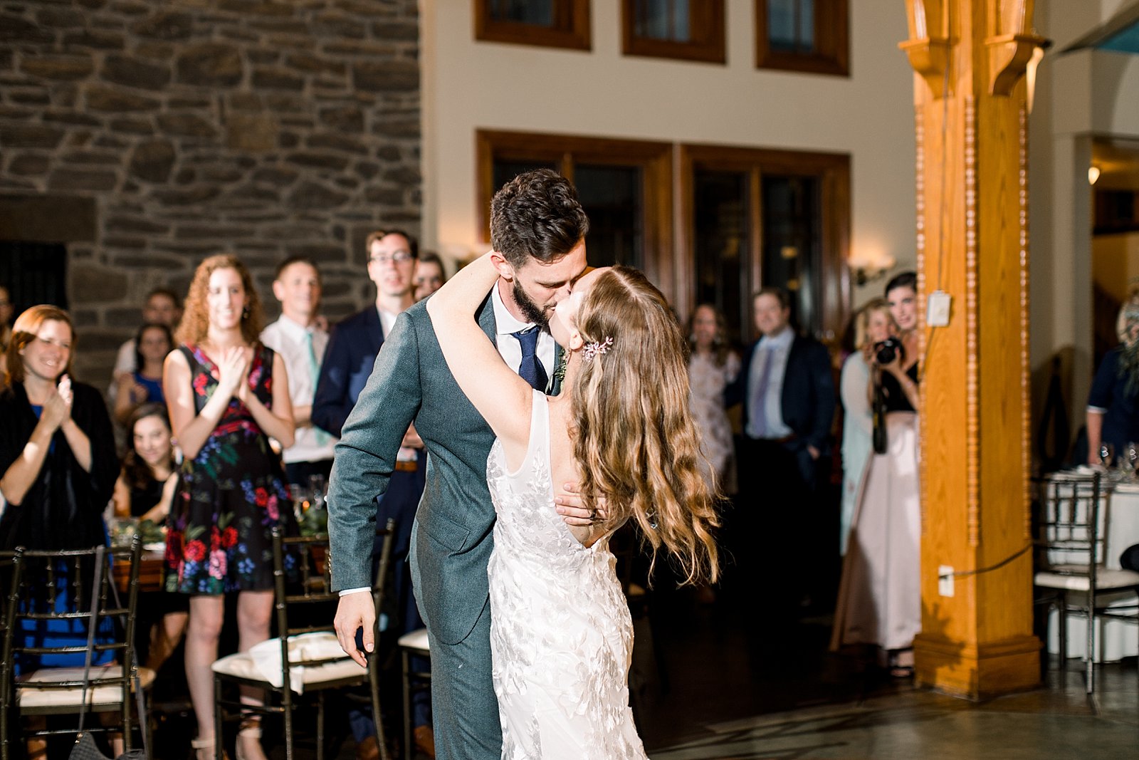 bride and groom kiss on dance floor at Knowlton Mansion