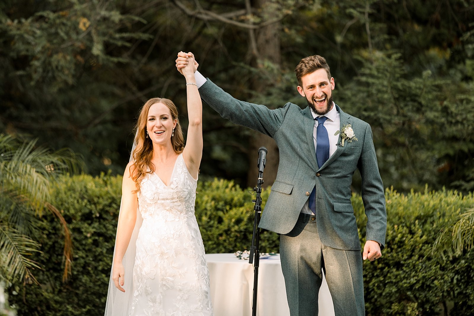 bride and groom cheer after Knowlton Mansion wedding ceremony on the lawn