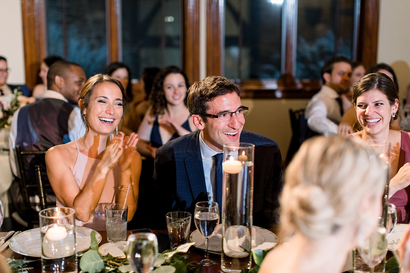 wedding guests laugh during toasts in Philadelphia PA