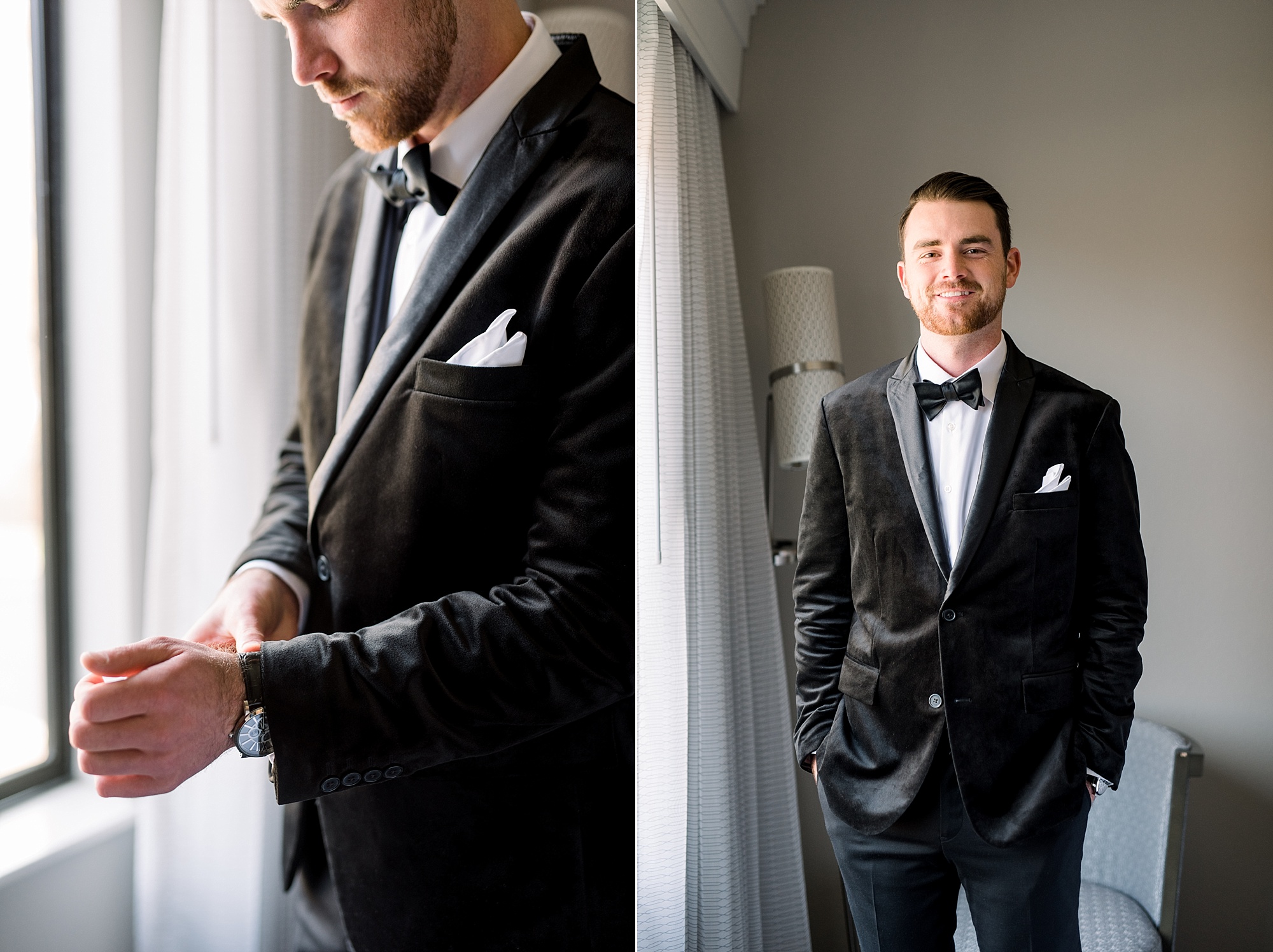groom in black velvet suit stands by window adjusting watch 