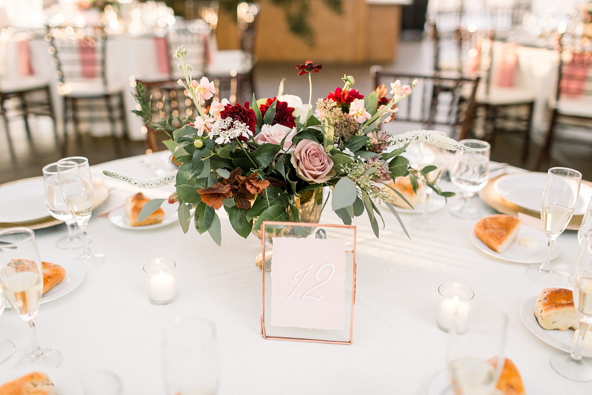 Tyler Gardens wedding reception with pink and red floral bouquet 