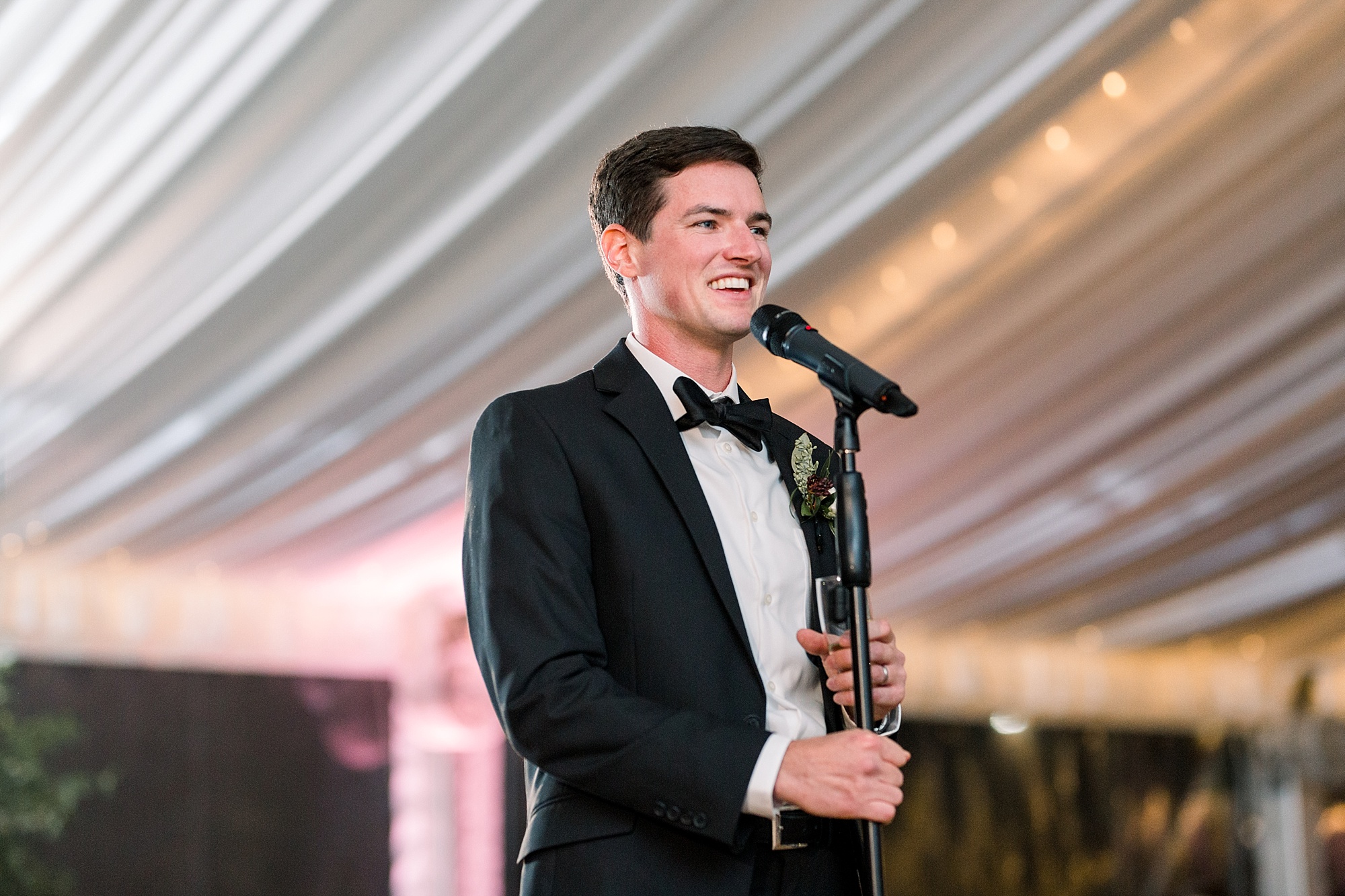 groomsman reads speech during Tyler Gardens wedding reception
