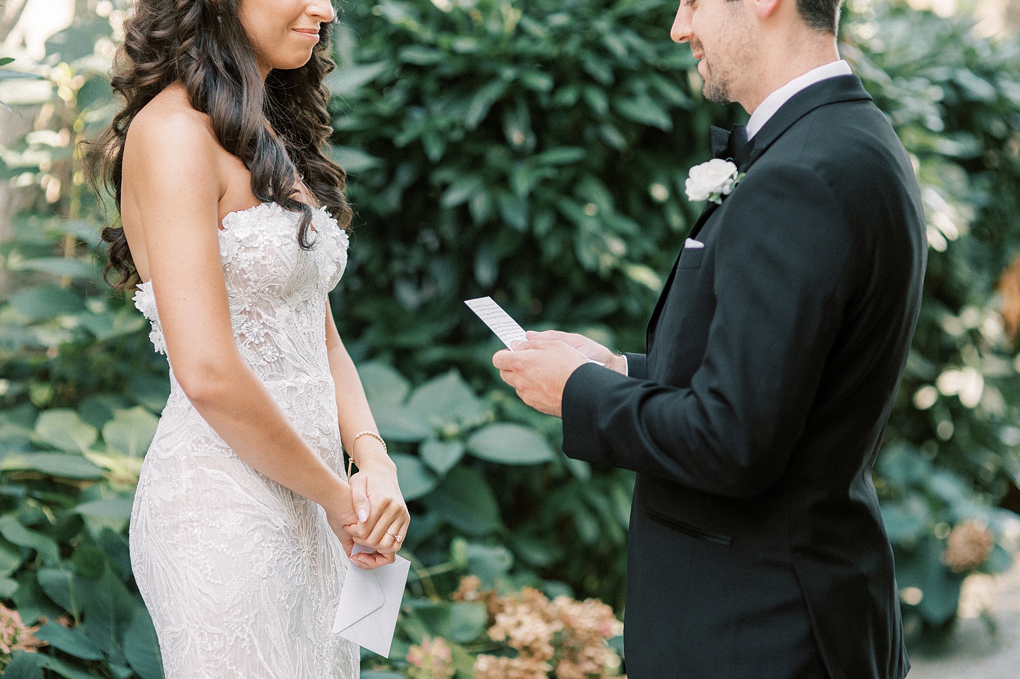 groom reads vows to bride 