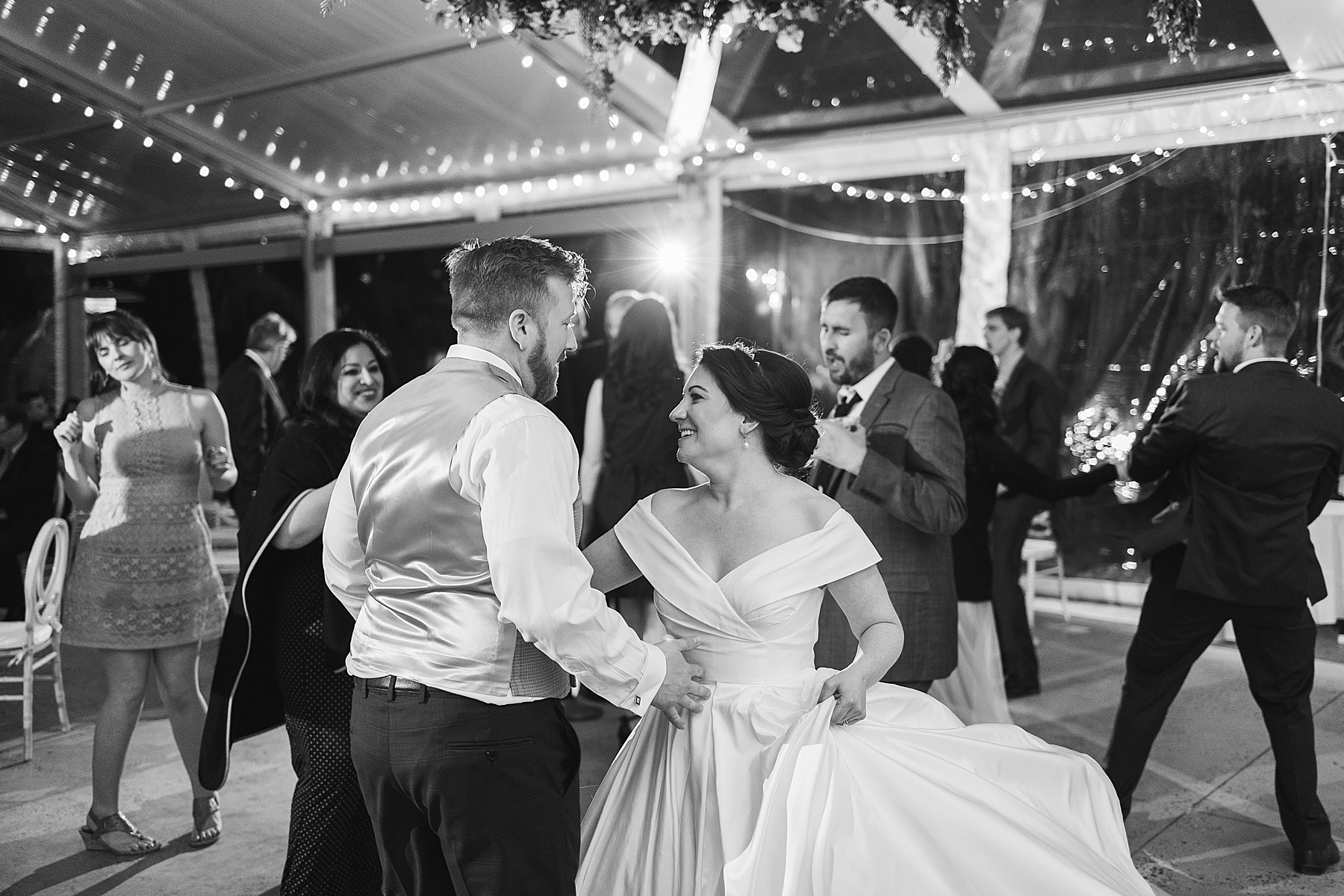 bride and groom dance together during Bellevue Hall wedding reception