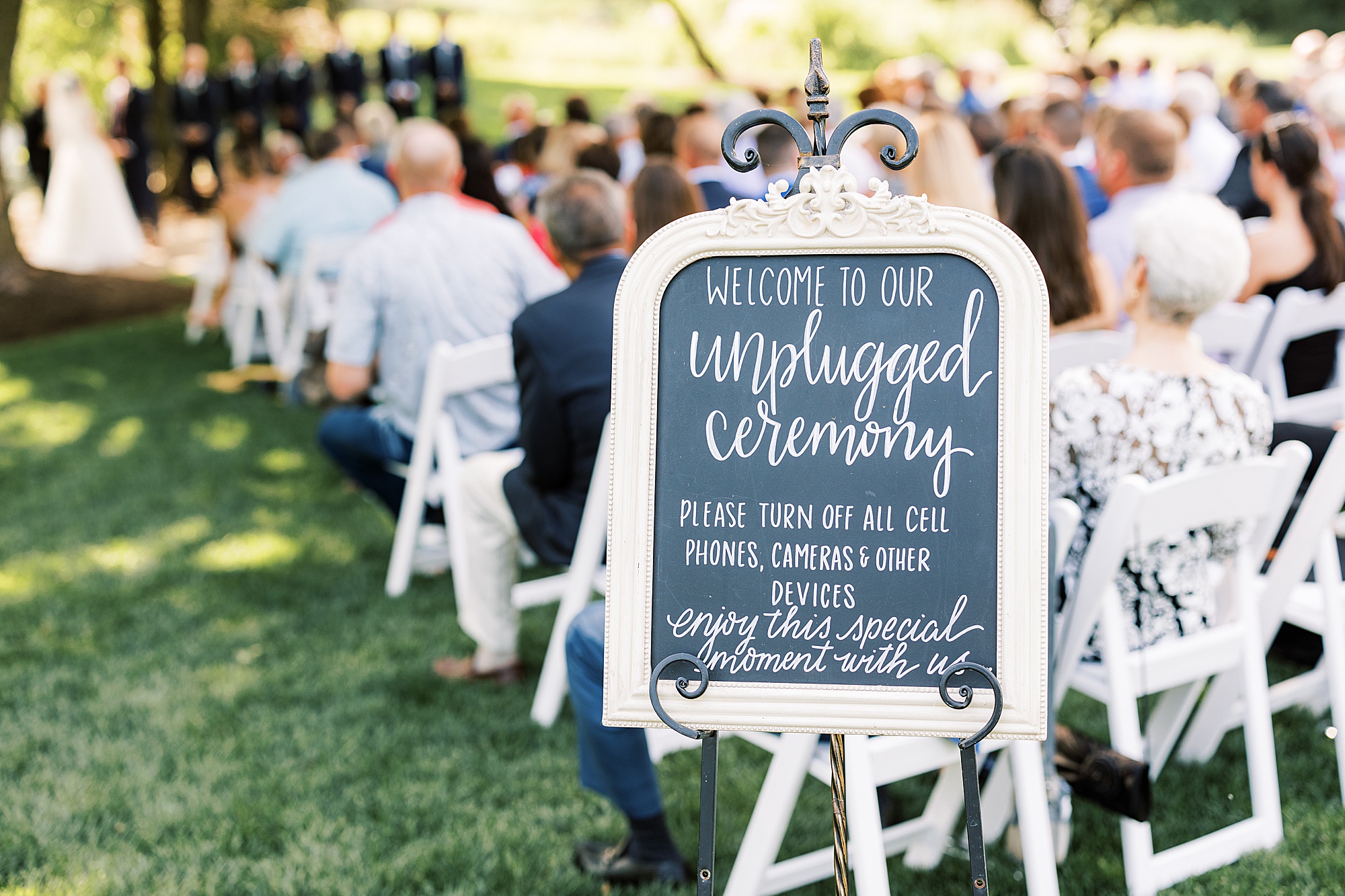 unplugged ceremony sign on edge of summer ceremony 