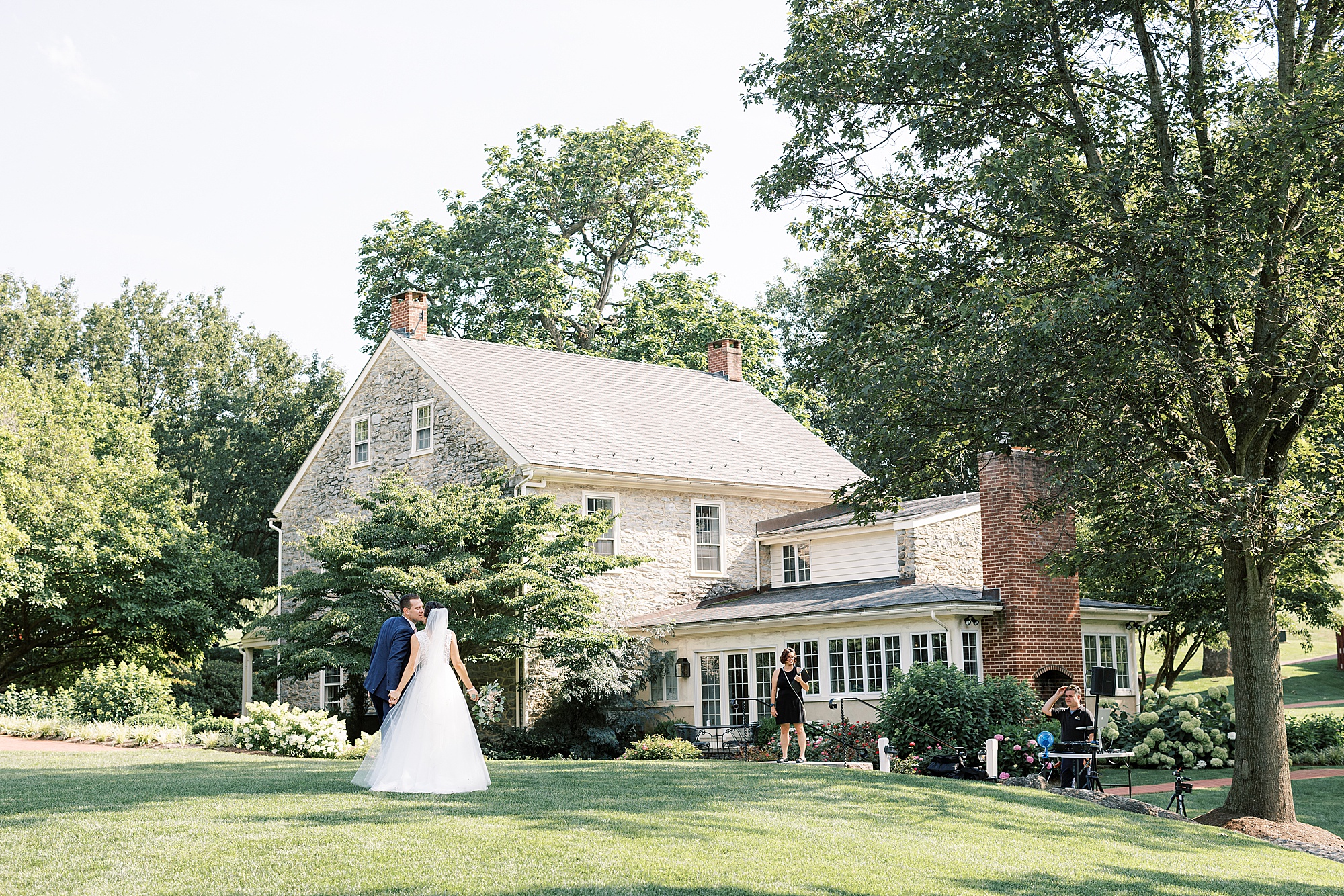 bride and groom approach house at  The Farm at Eagles Ridge 