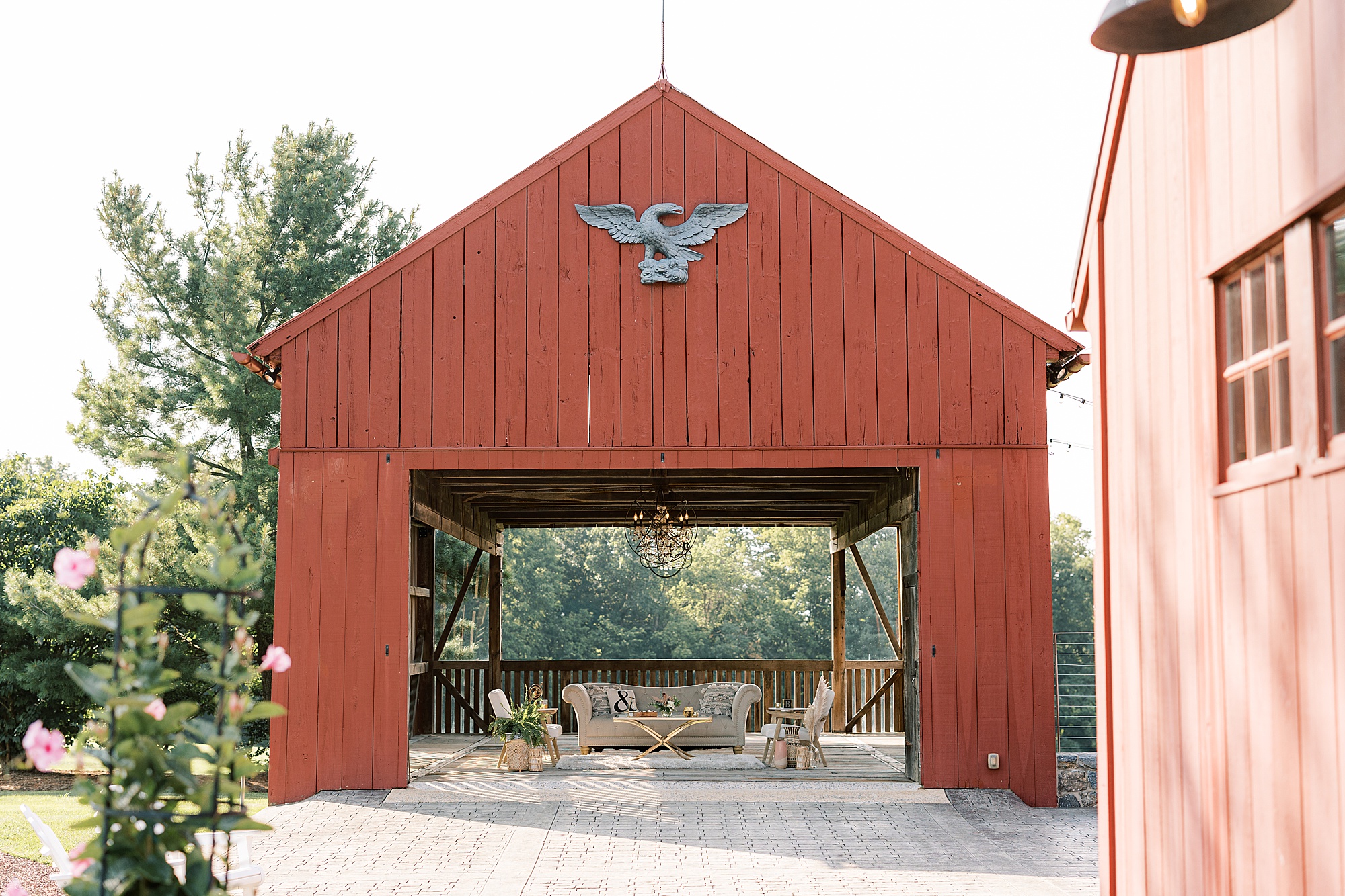 red barn with seating area underneath at The Farm at Eagles Ridge 