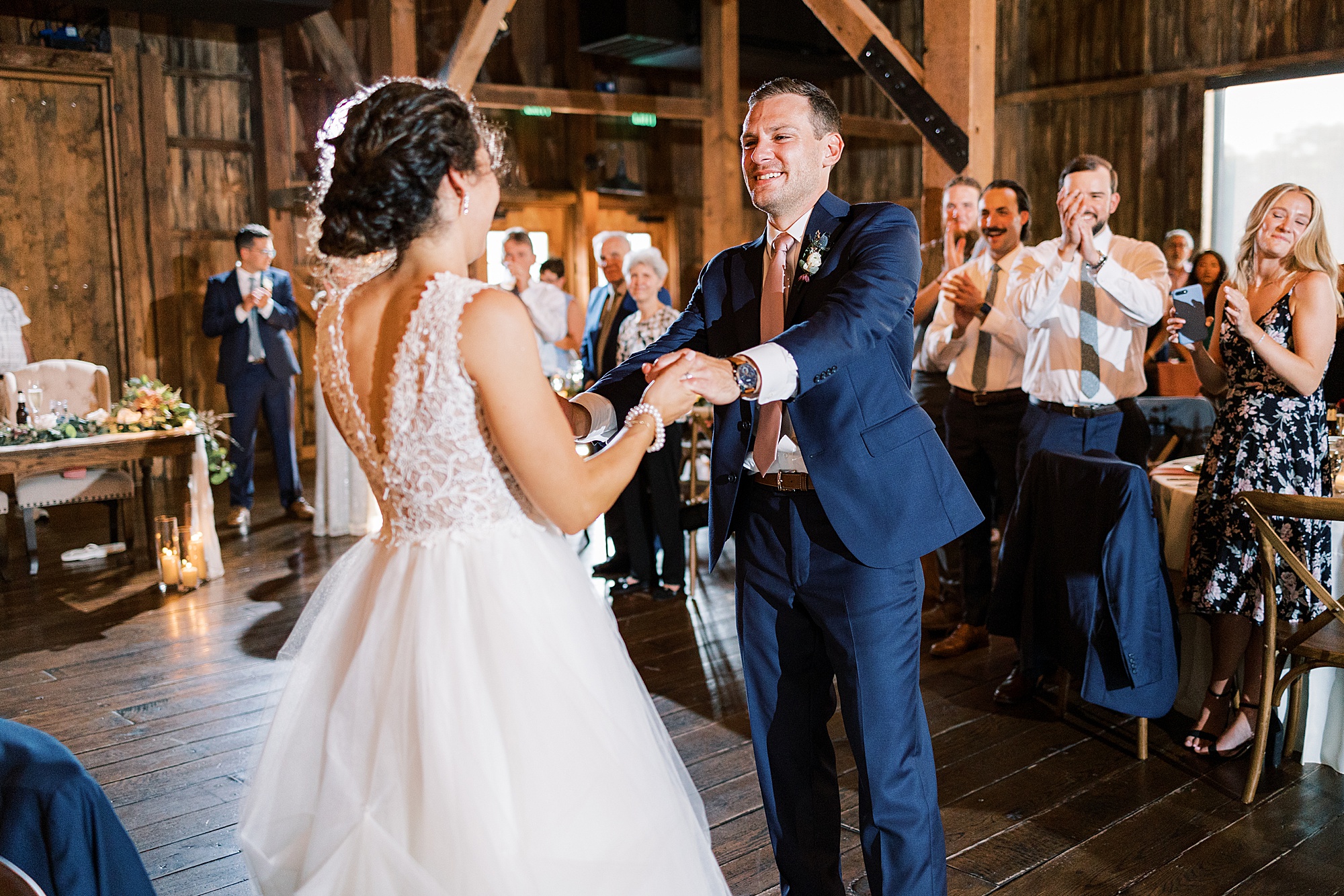 groom twirls bride out during Lancaster PA wedding reception