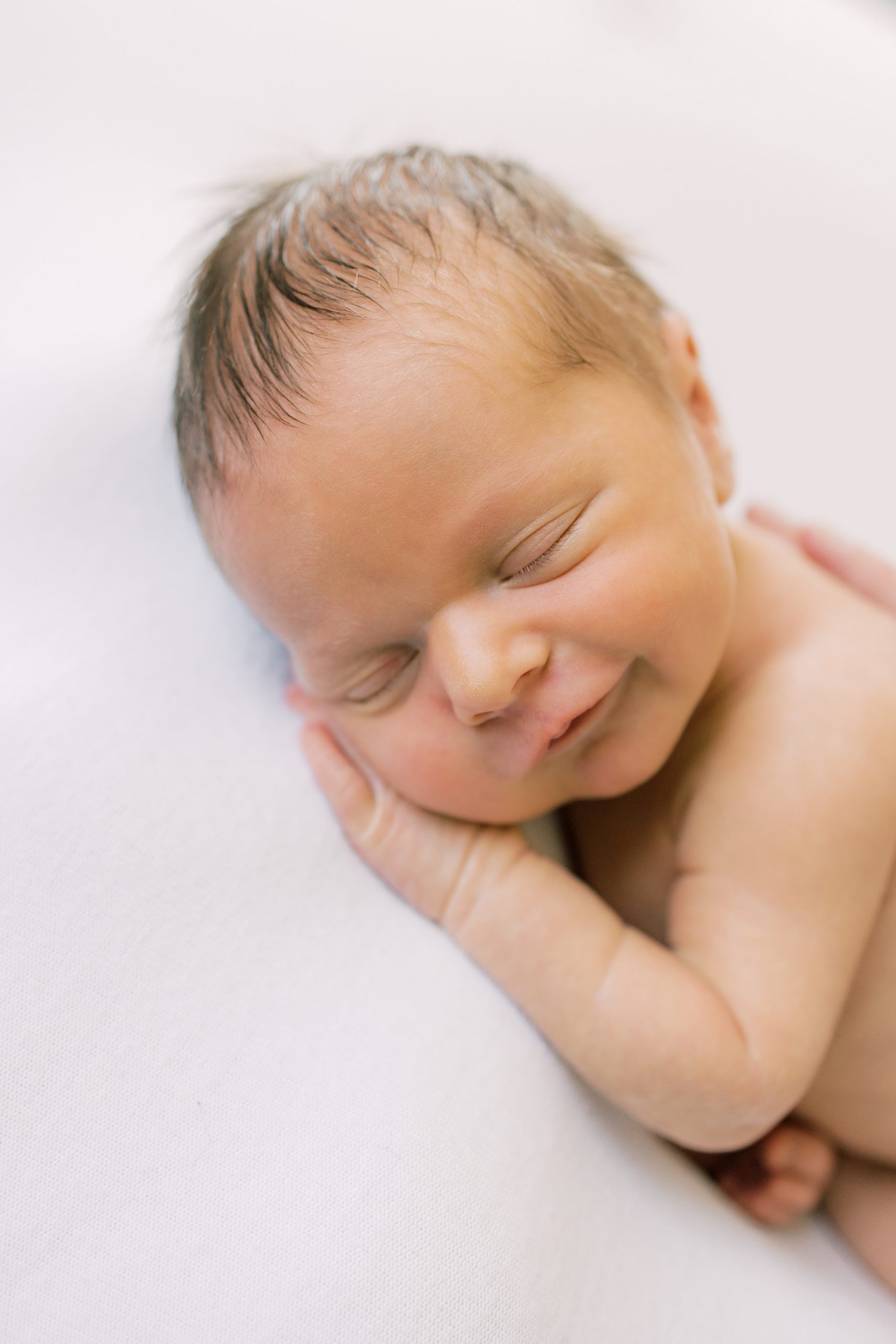 Fine Art Newborn Photography close up image of sleeping newborn baby by Philadelphia Photographer Samantha Jay