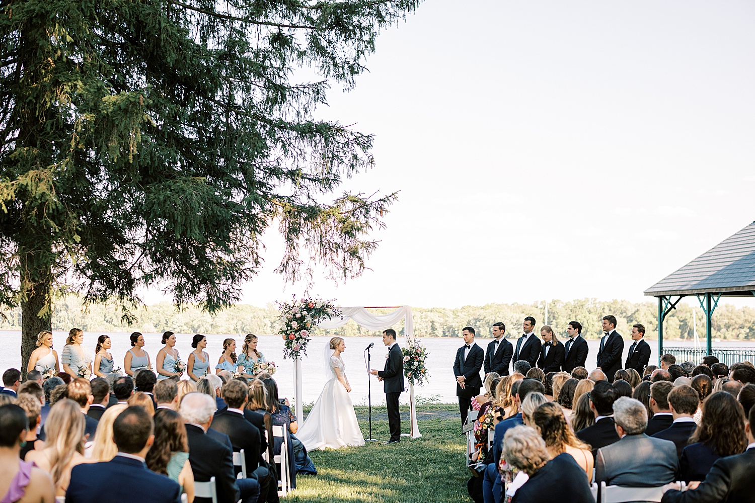 waterfront wedding ceremony in the garden at Glen Foerd on the Delaware