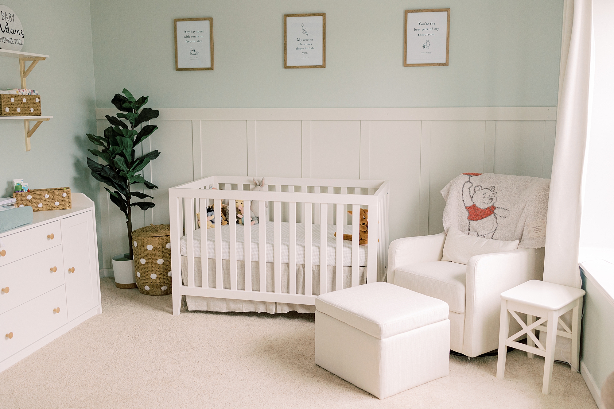 Winnie the Pooh nursery with green and white details 