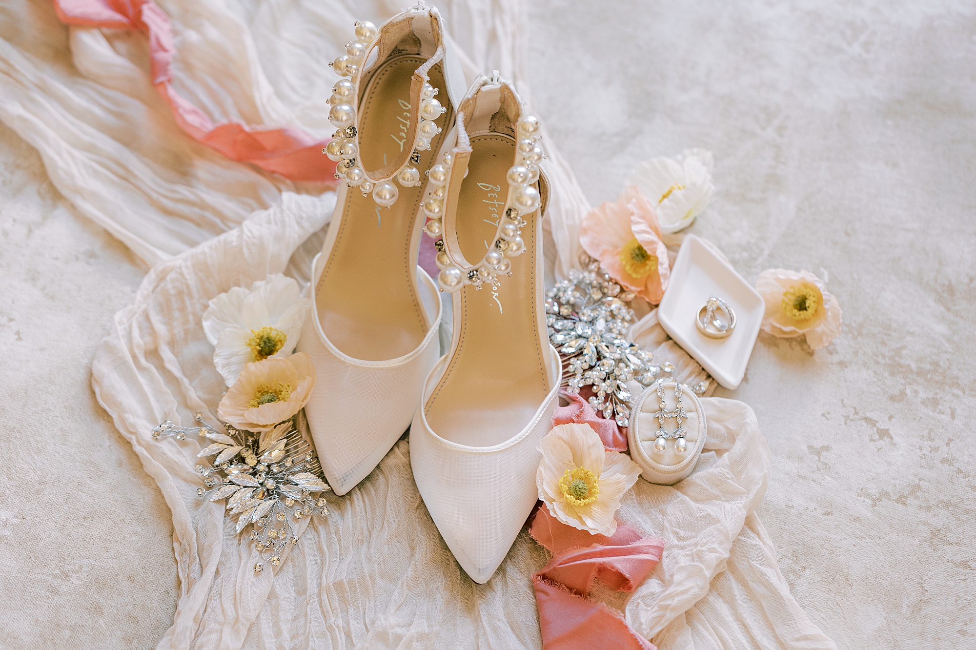 bride's ivory shoes with florals and coral ribbon 