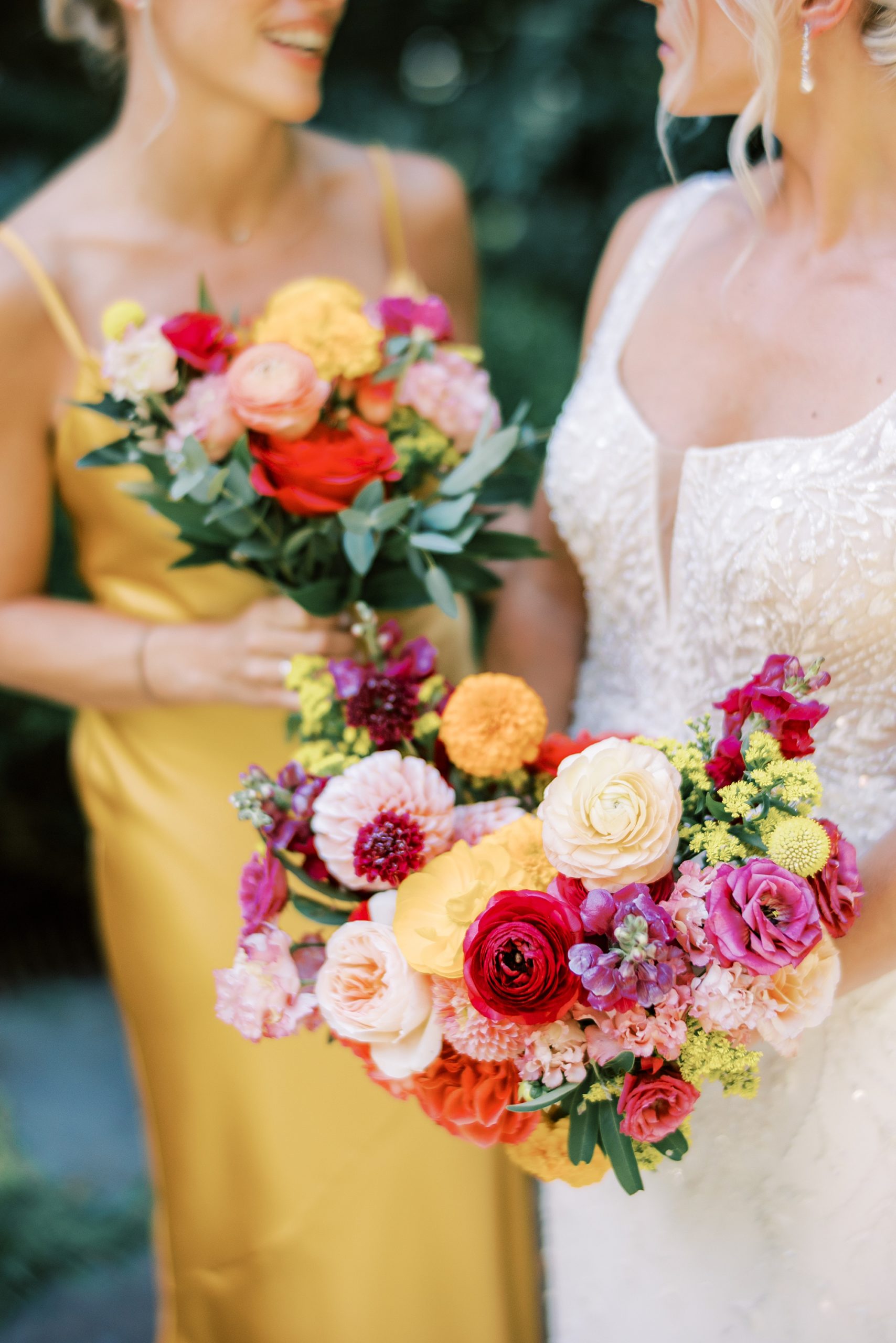bride holds bouquet of bright summer florals for wedding at Parque Ridley Creek