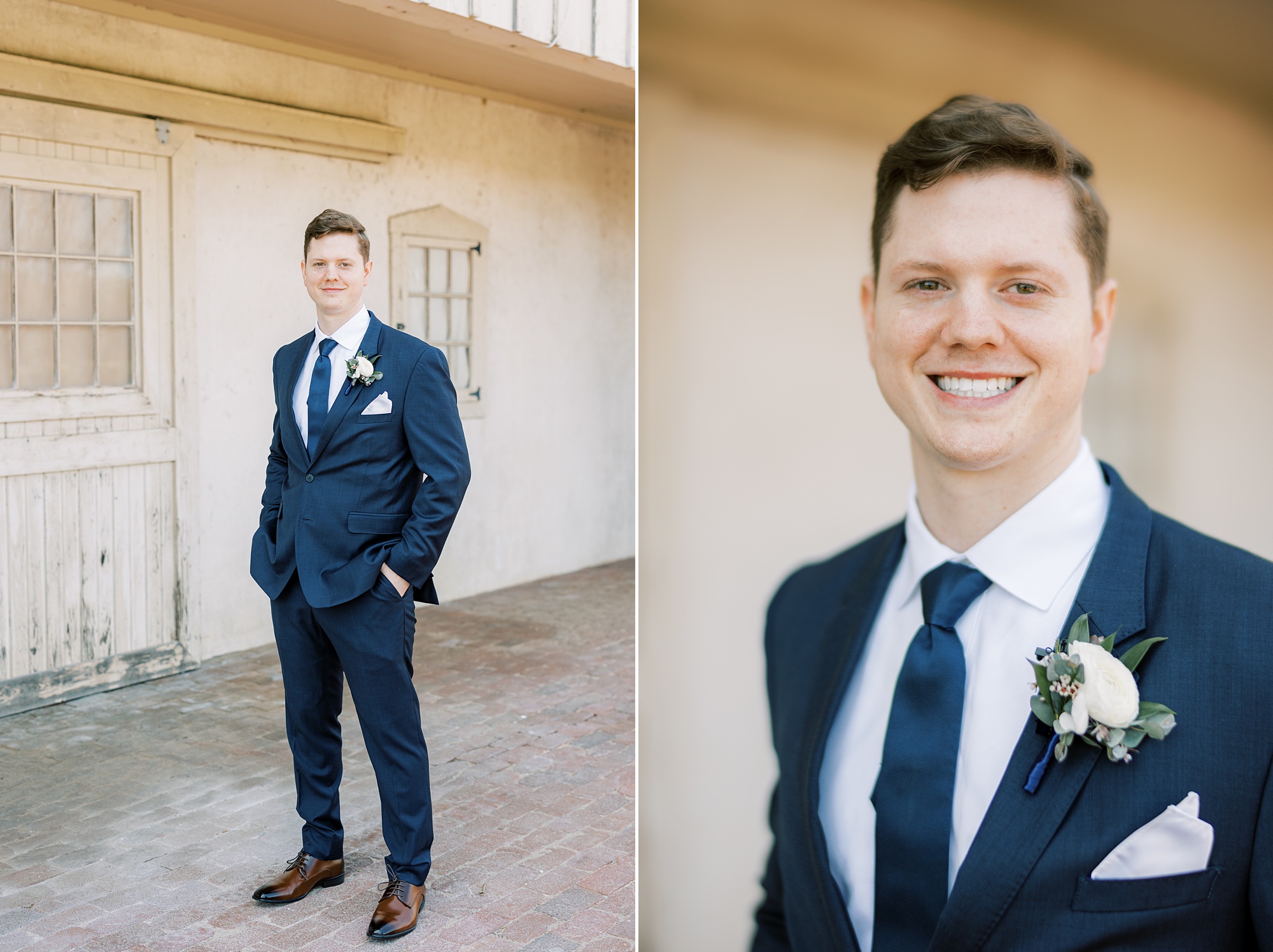groom stands in navy suit with white boutonnière 