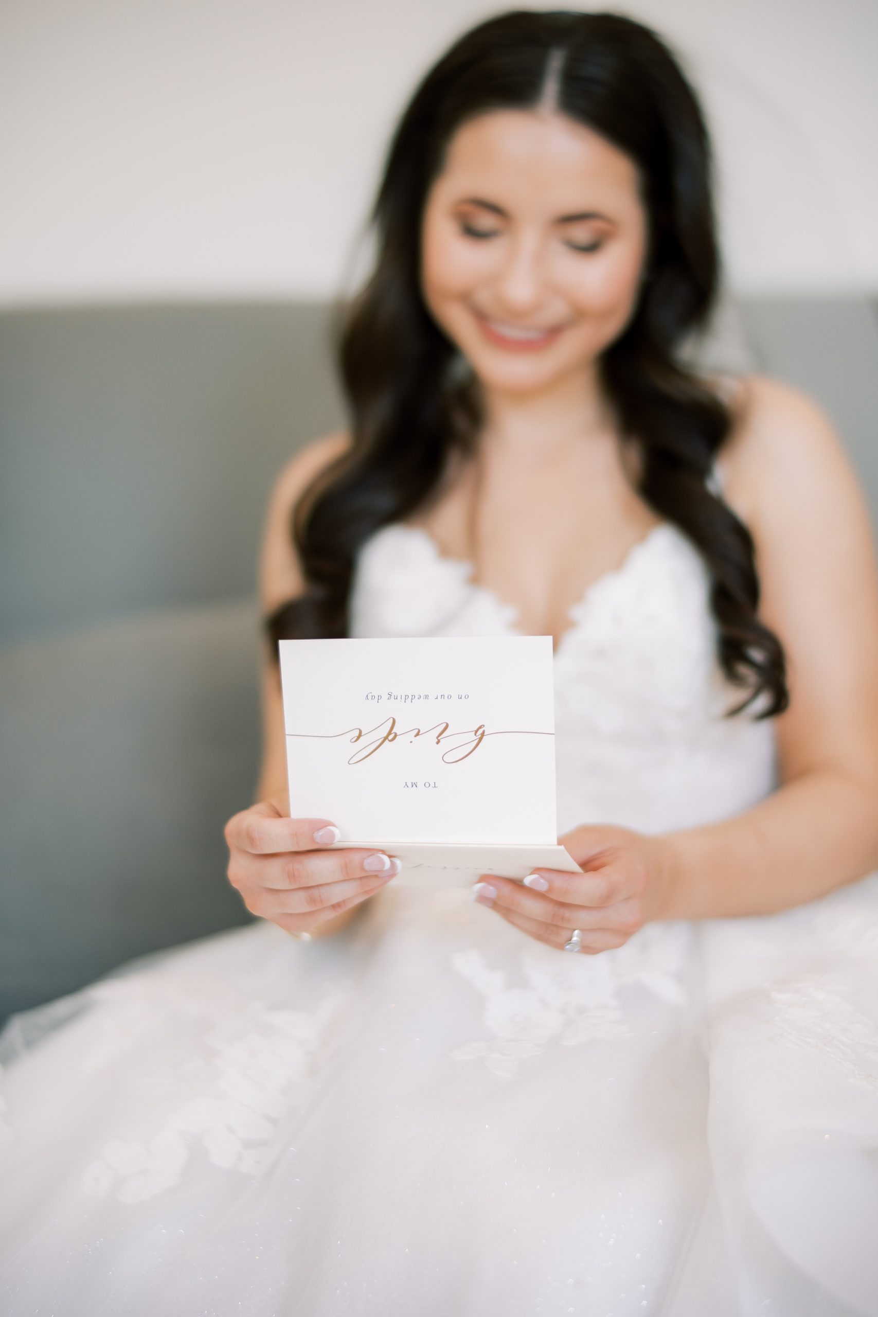 bride reads card from groom on wedding morning 