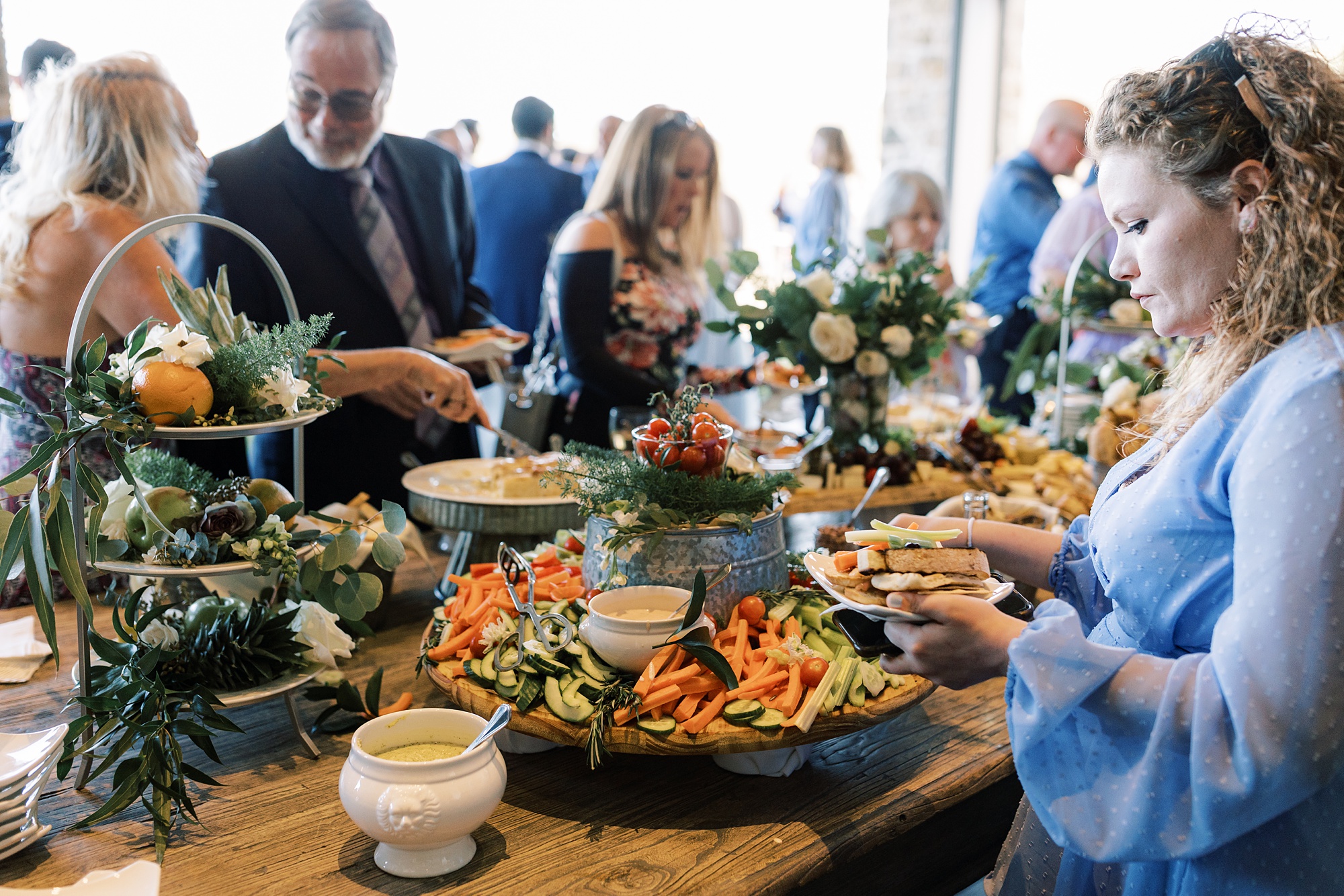 guests pick food from display at cocktail hour 