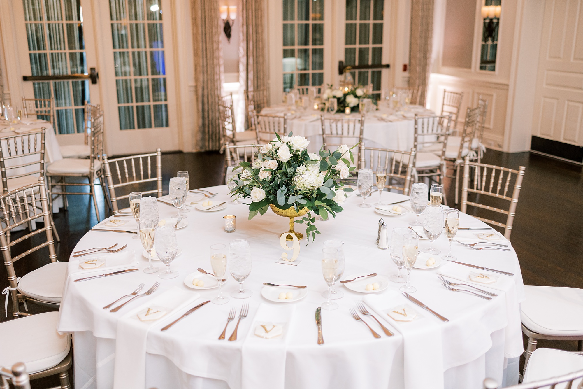 reception table with ivory flowers in center at French Creek Golf Club 