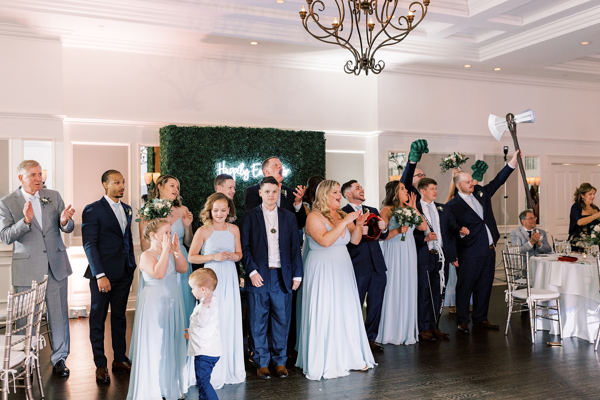 wedding party claps for bride and groom