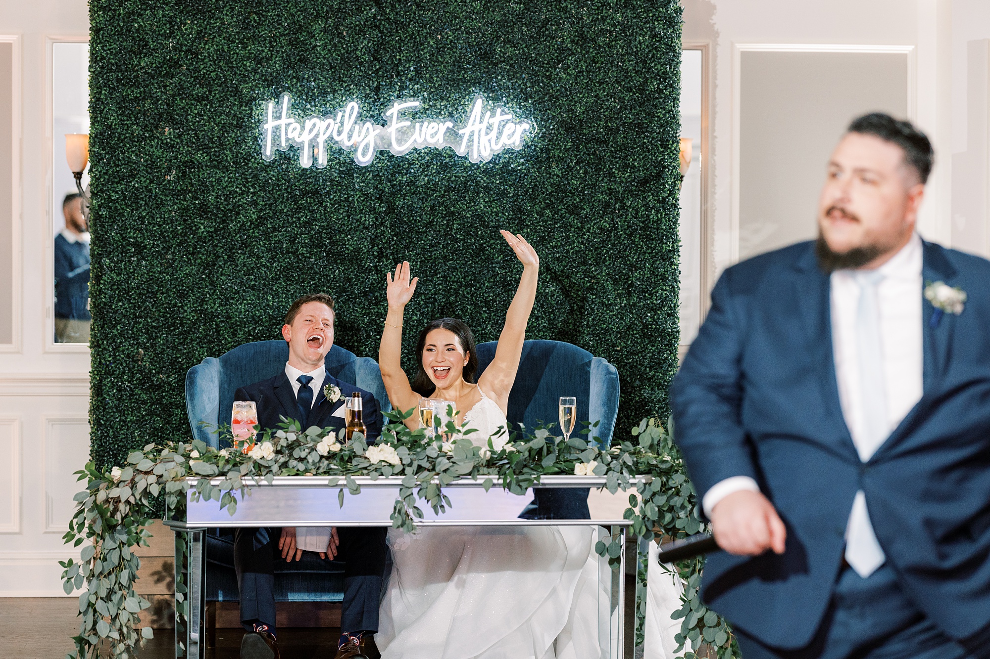 bride and groom cheer during Chester County PA wedding reception