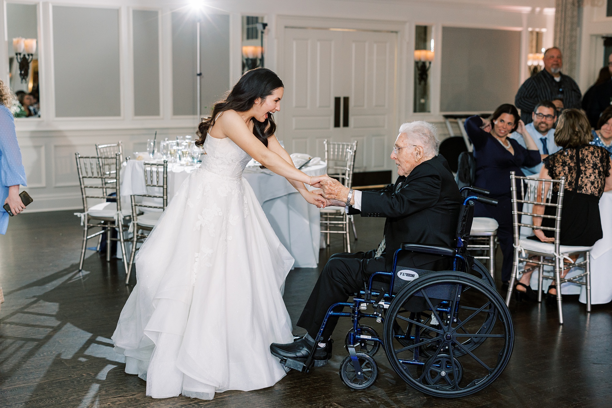 bride dances with grandfather in wheelchair during Chester County PA wedding reception