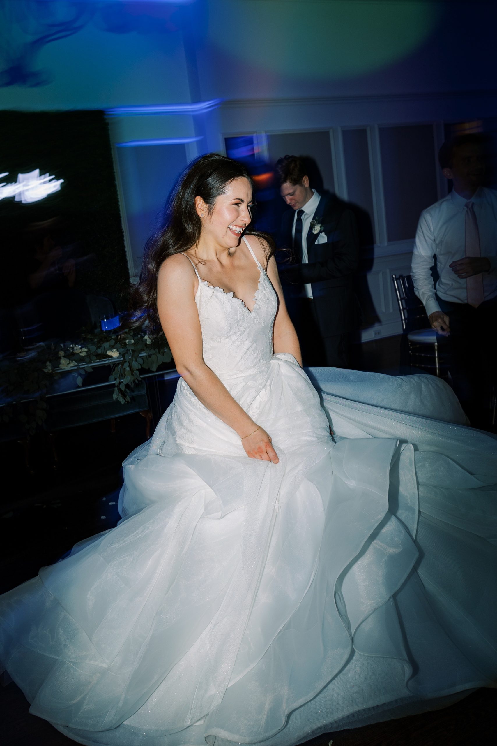 bride twirls wedding dress during Chester County PA wedding reception