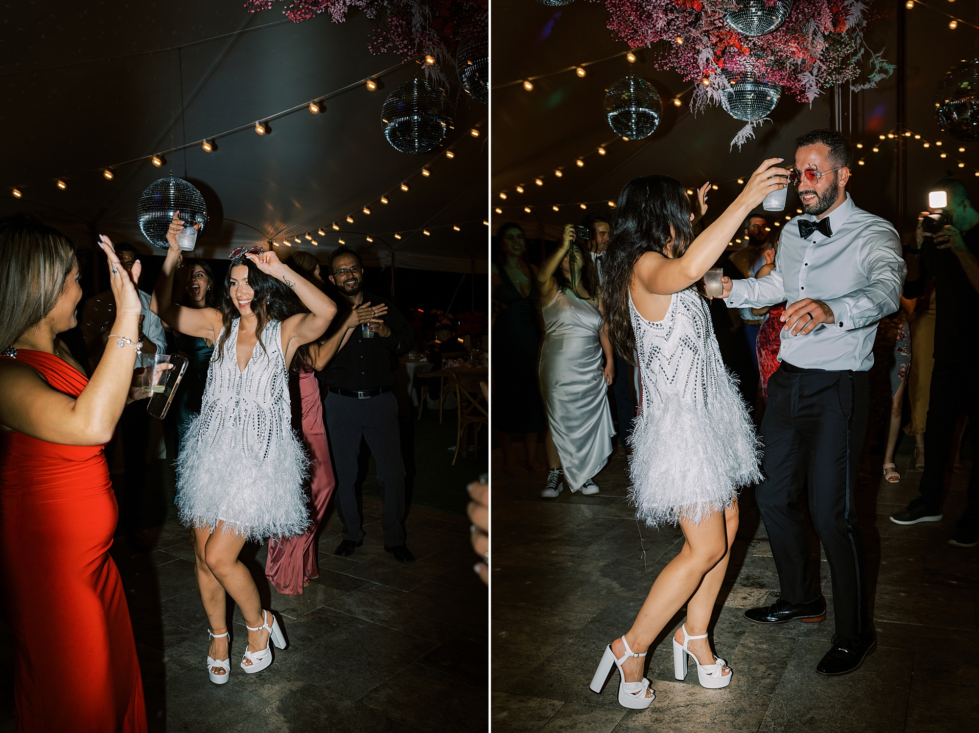 bride in short wedding dress dances with husband at reception 