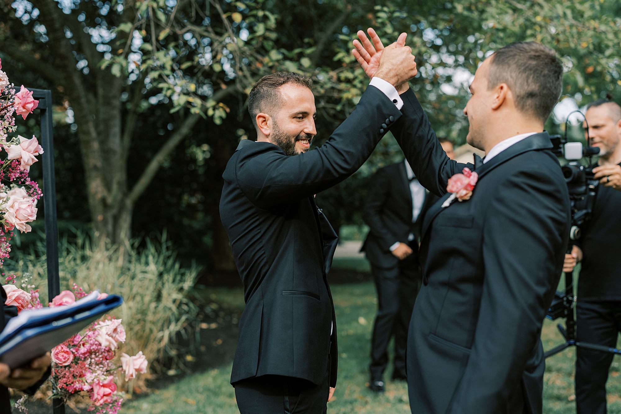 groom does handshake with groomsman before ceremony at The Cypress House