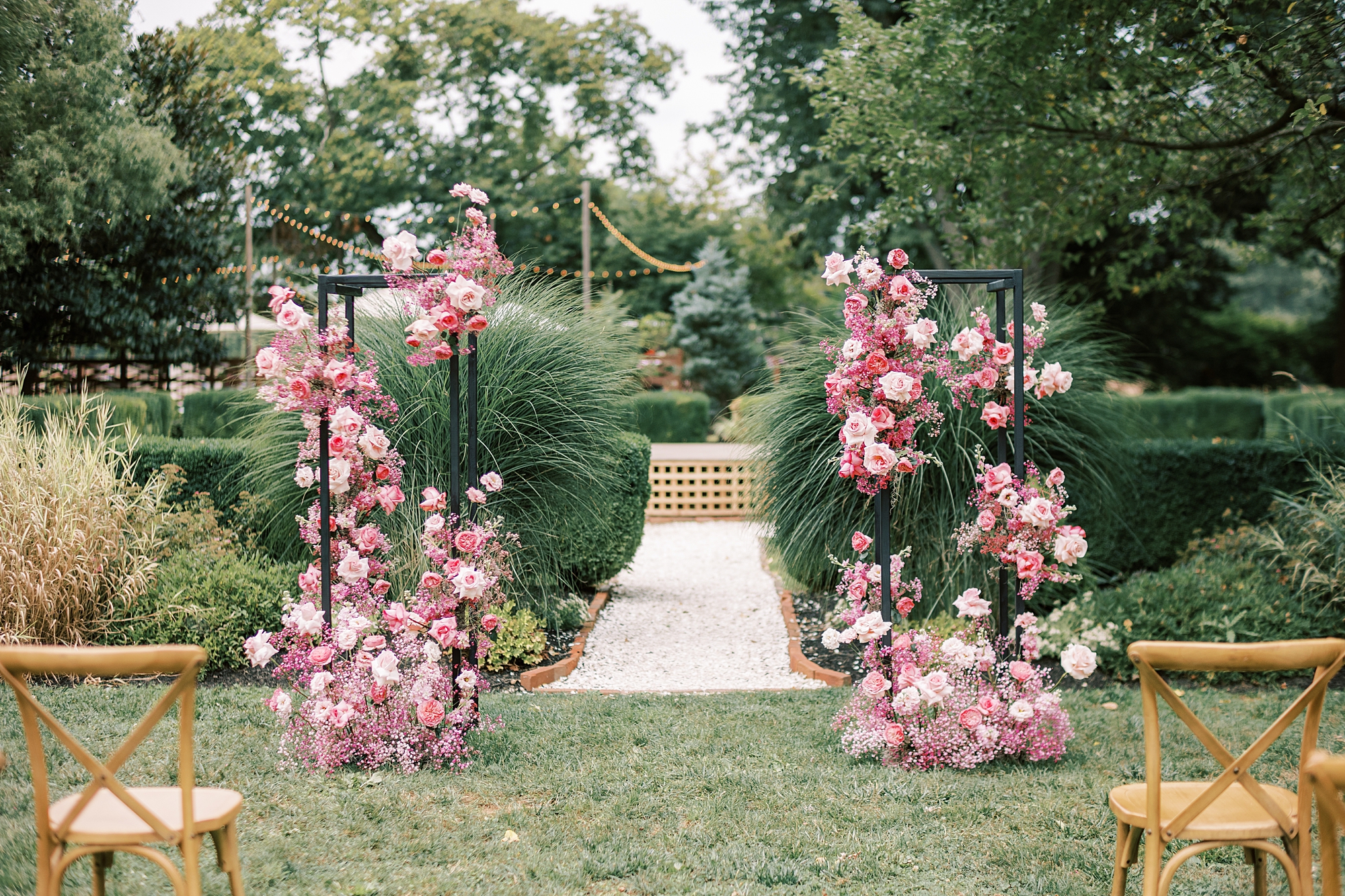 floral display for ceremony with pink monochromatic florals 