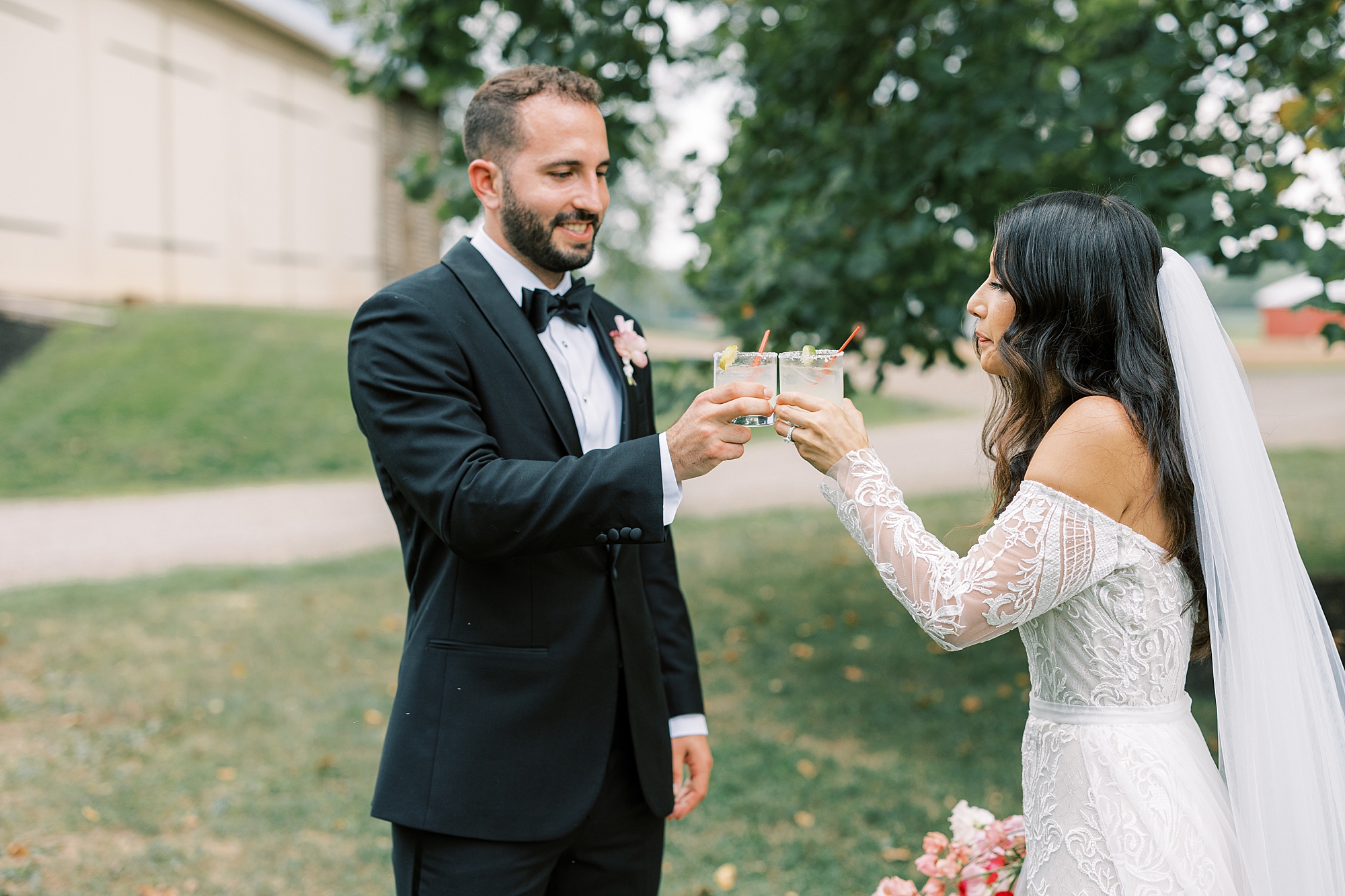 bride and groom toast champagne during portraits 