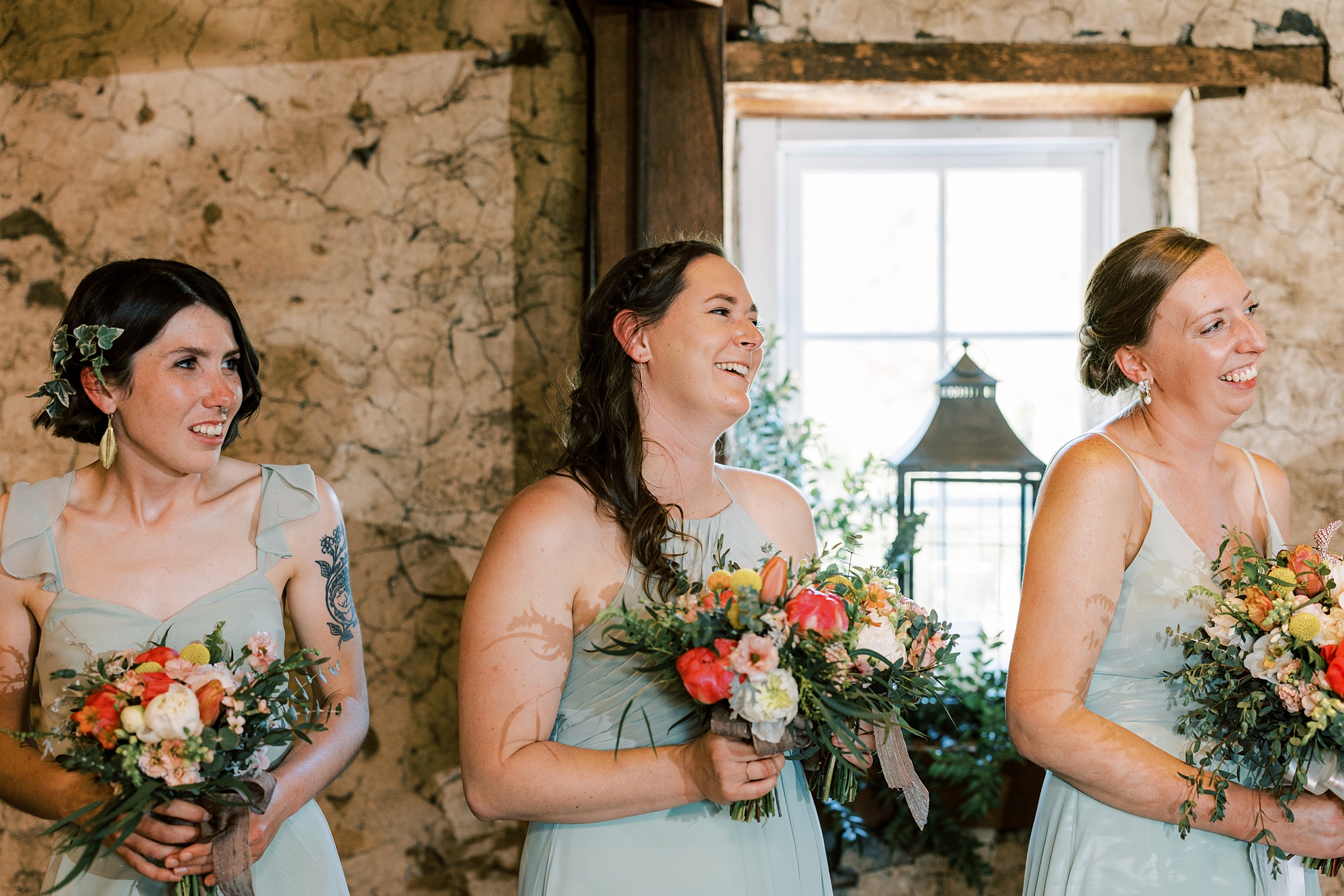 bridesmaid laughs during wedding ceremony 