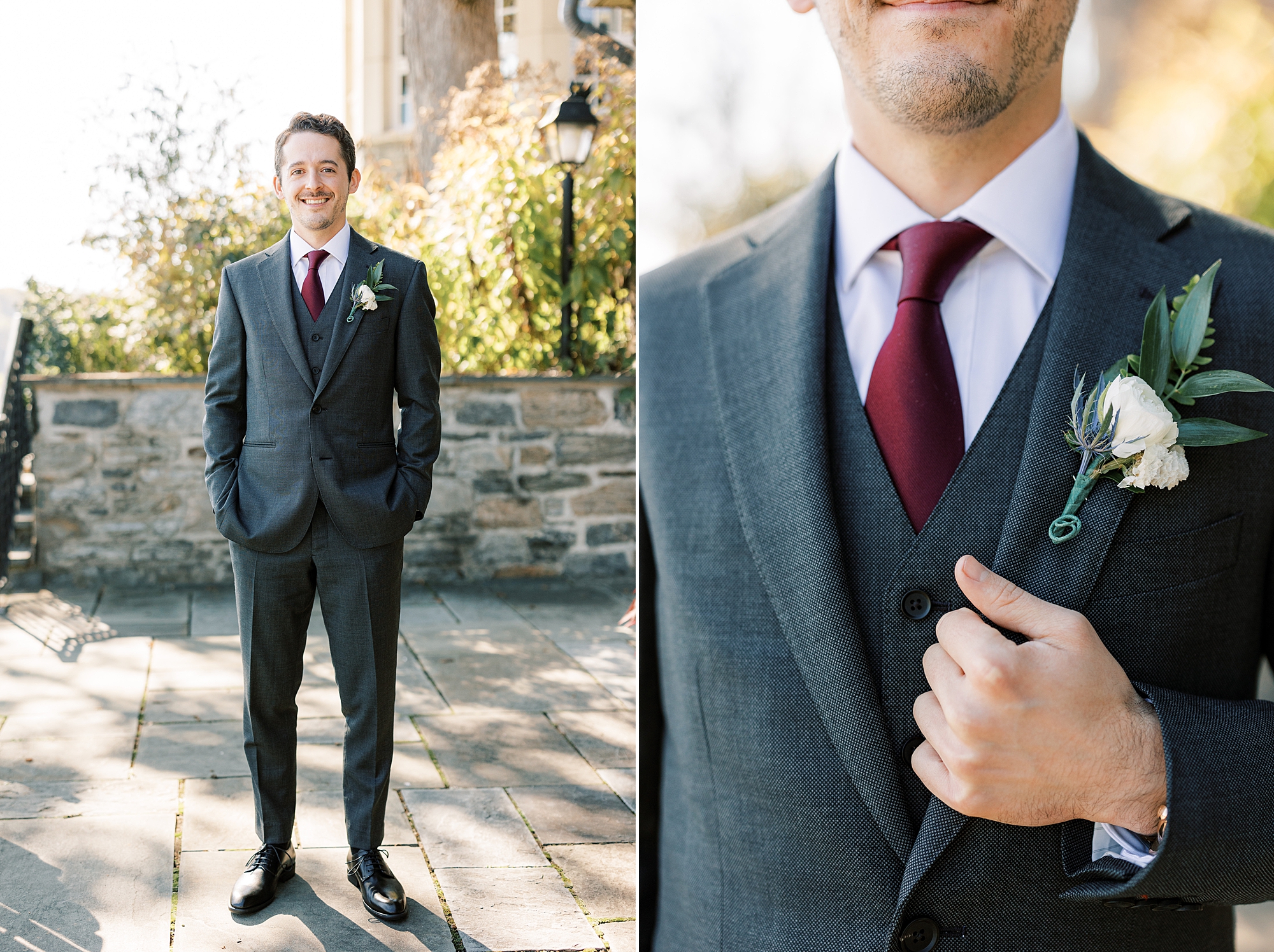 groom holds lapel of grey suit with burgundy tie