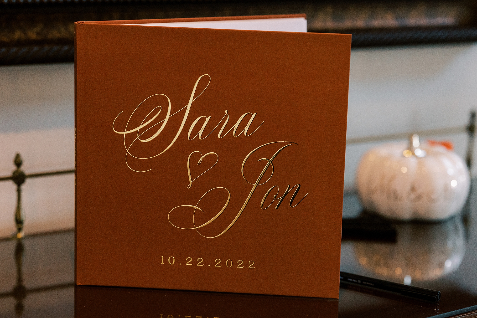 burgundy album with gold lettering