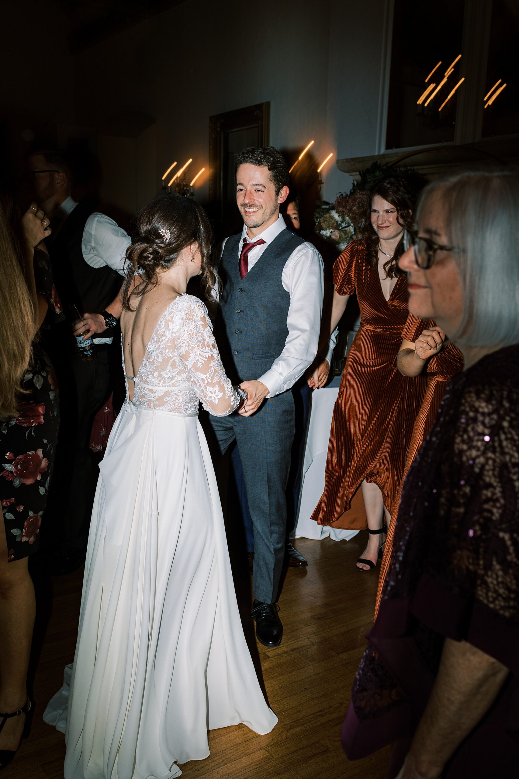 bride and groom dance with wedding guests during PA wedding reception