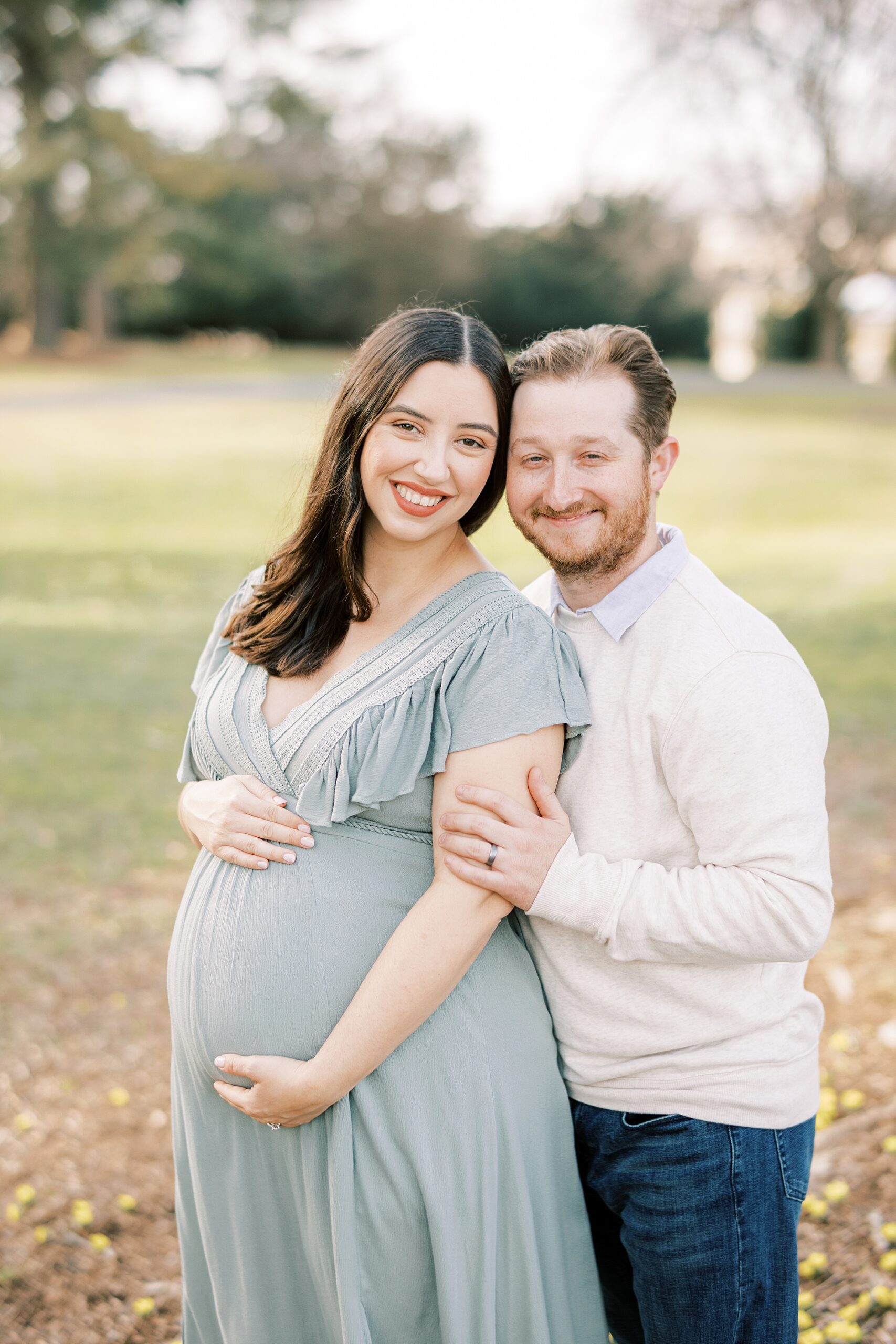 couple hugs among leaves at Longwood Gardens