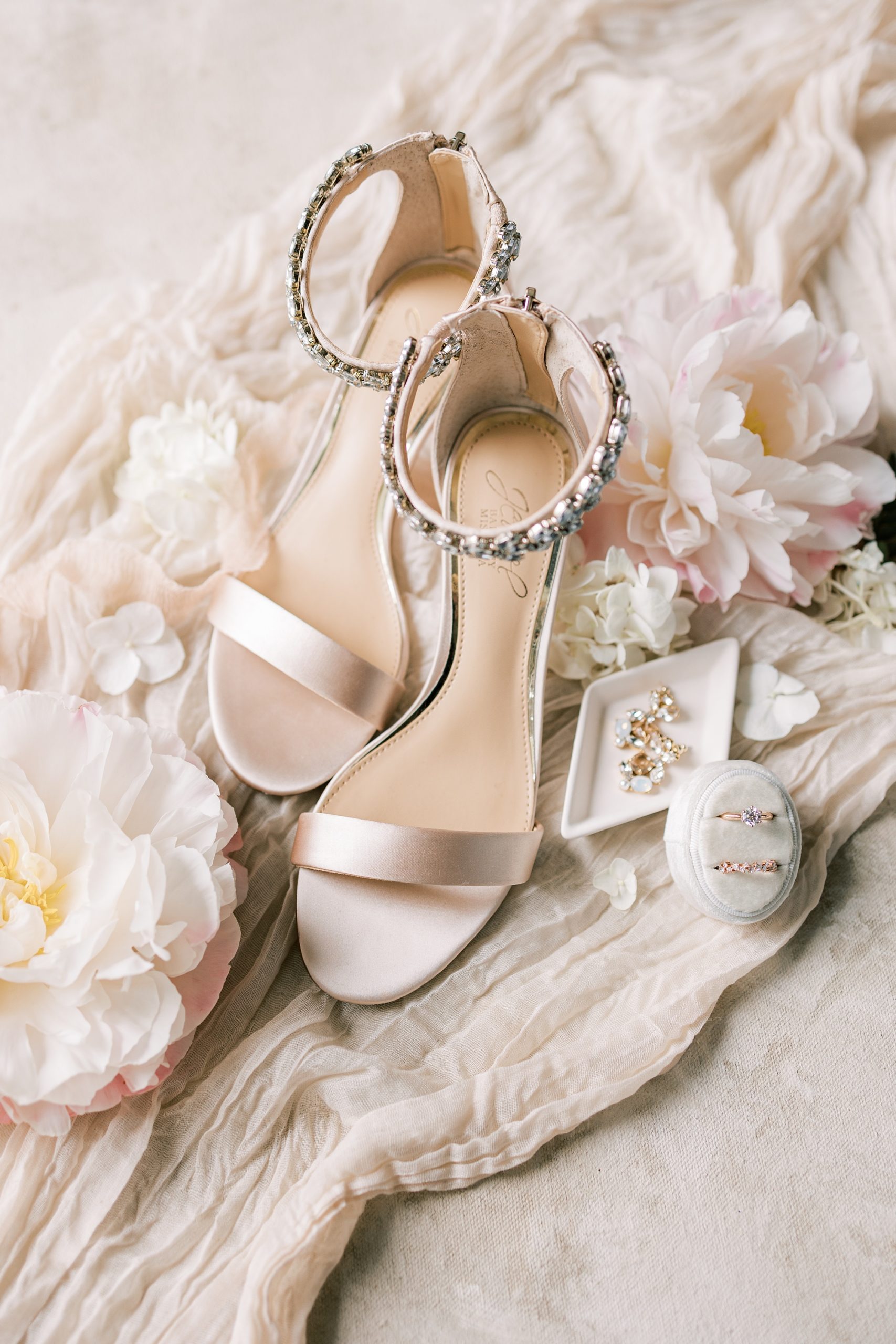bride's silver shoes for wedding day at The River House at Odette's