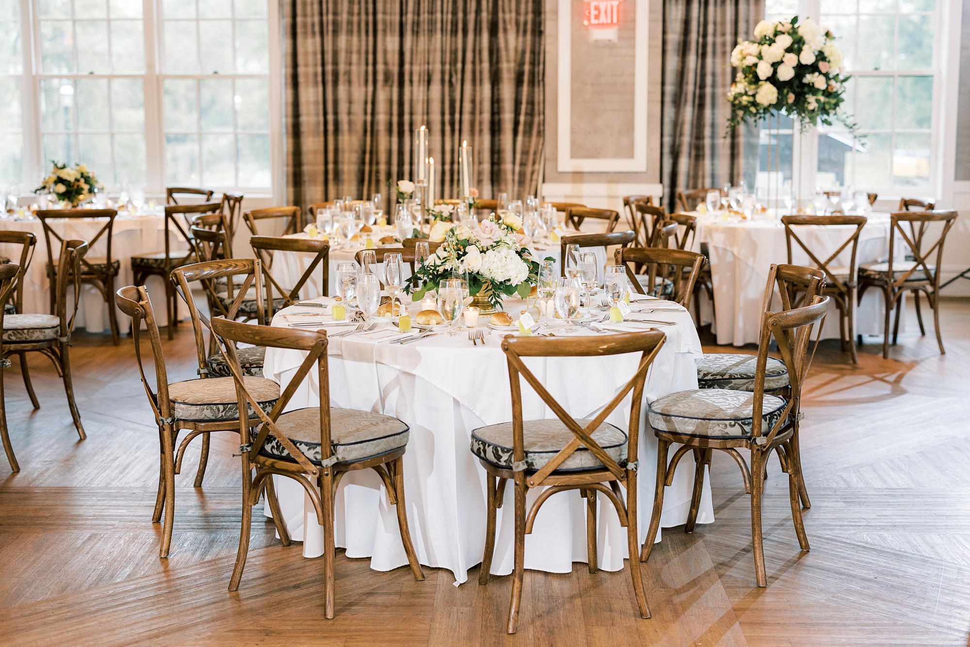 Italian inspired wedding reception at The River House at Odette's with wooden chairs and citrus inspired centerpieces 