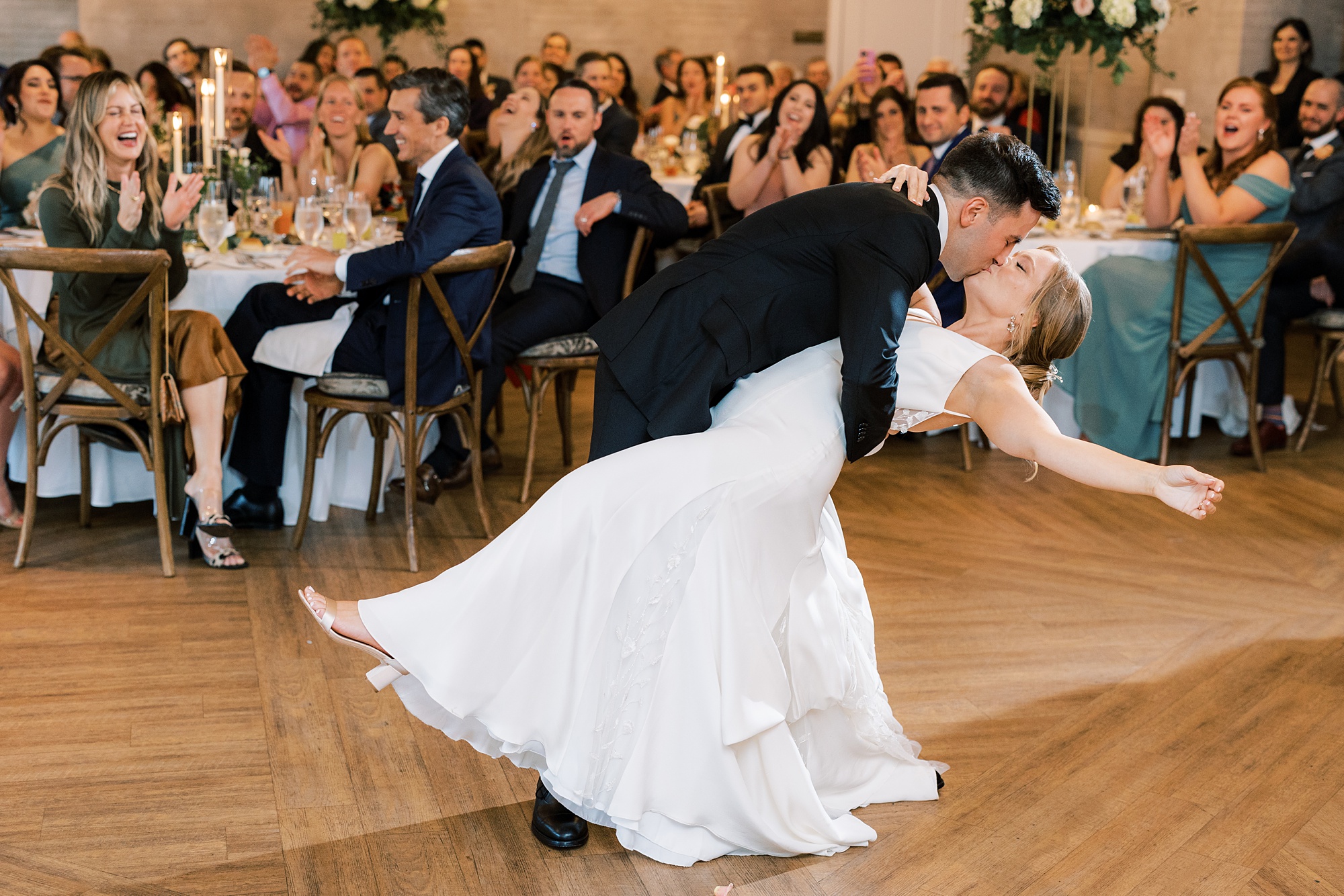 groom dips bride during first dance at New Hope PA wedding reception 