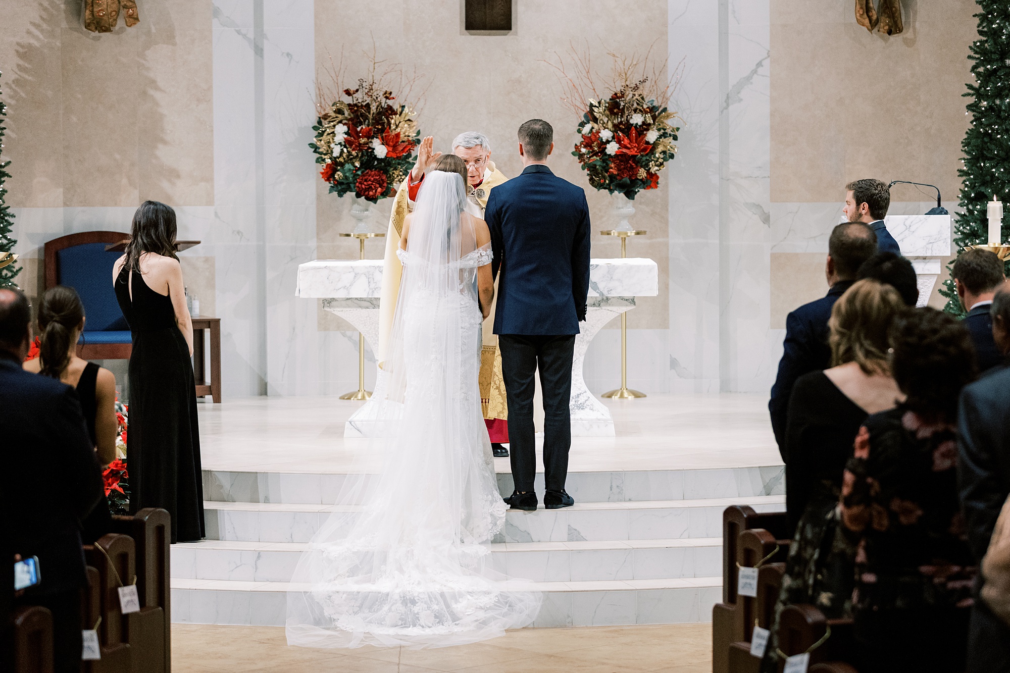 bride and groom stand at alter during wedding ceremony at St. Helen's Church in Westfield NJ