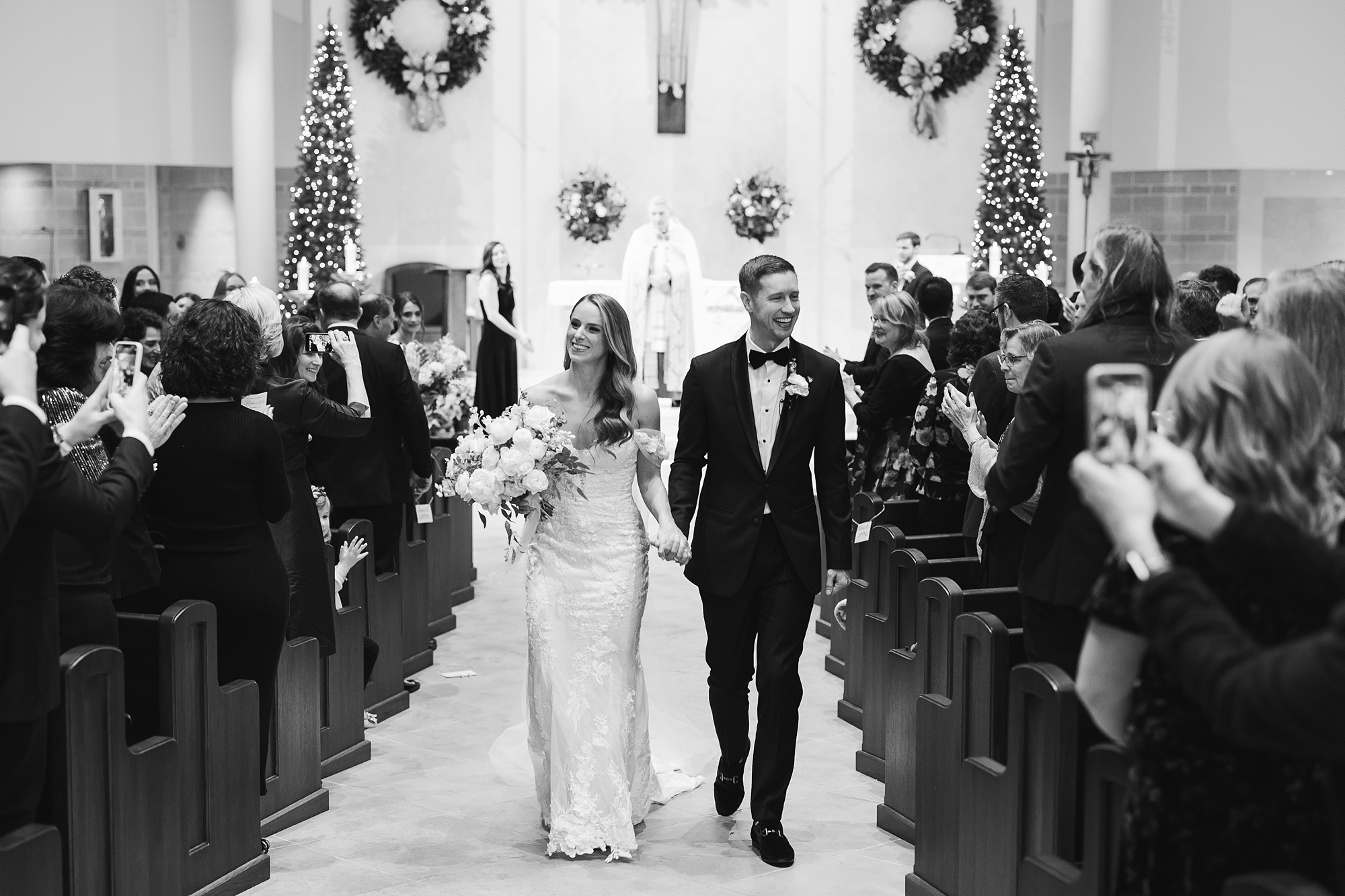 bride and groom walk up aisle after wedding ceremony at St. Helen's Church in Westfield NJ