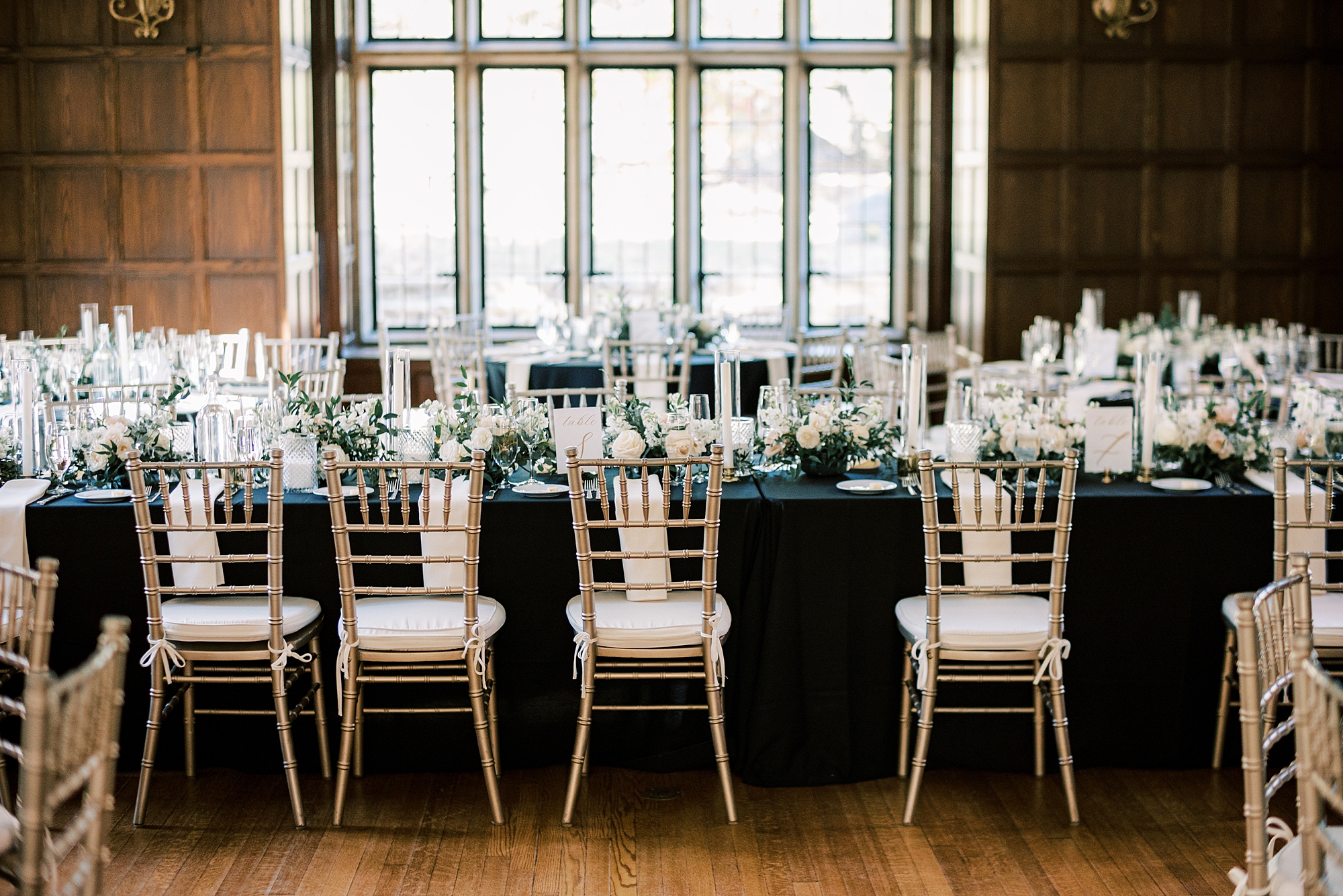 classic wedding reception at Parque Ridley Creek with gold chivari chairs 