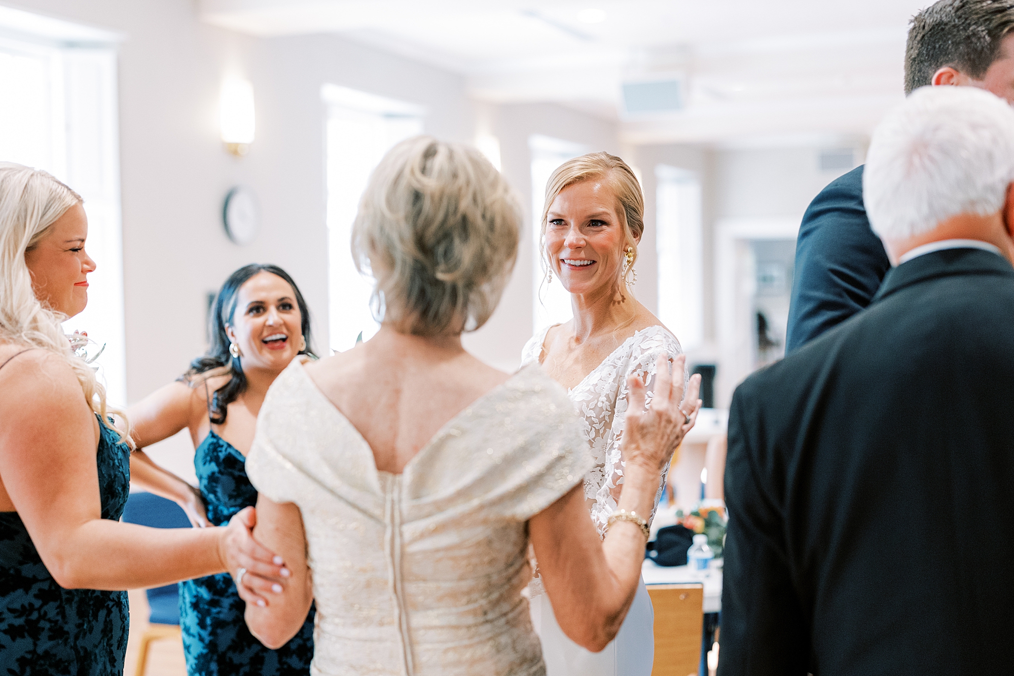 bride talks with mother after wedding ceremony 