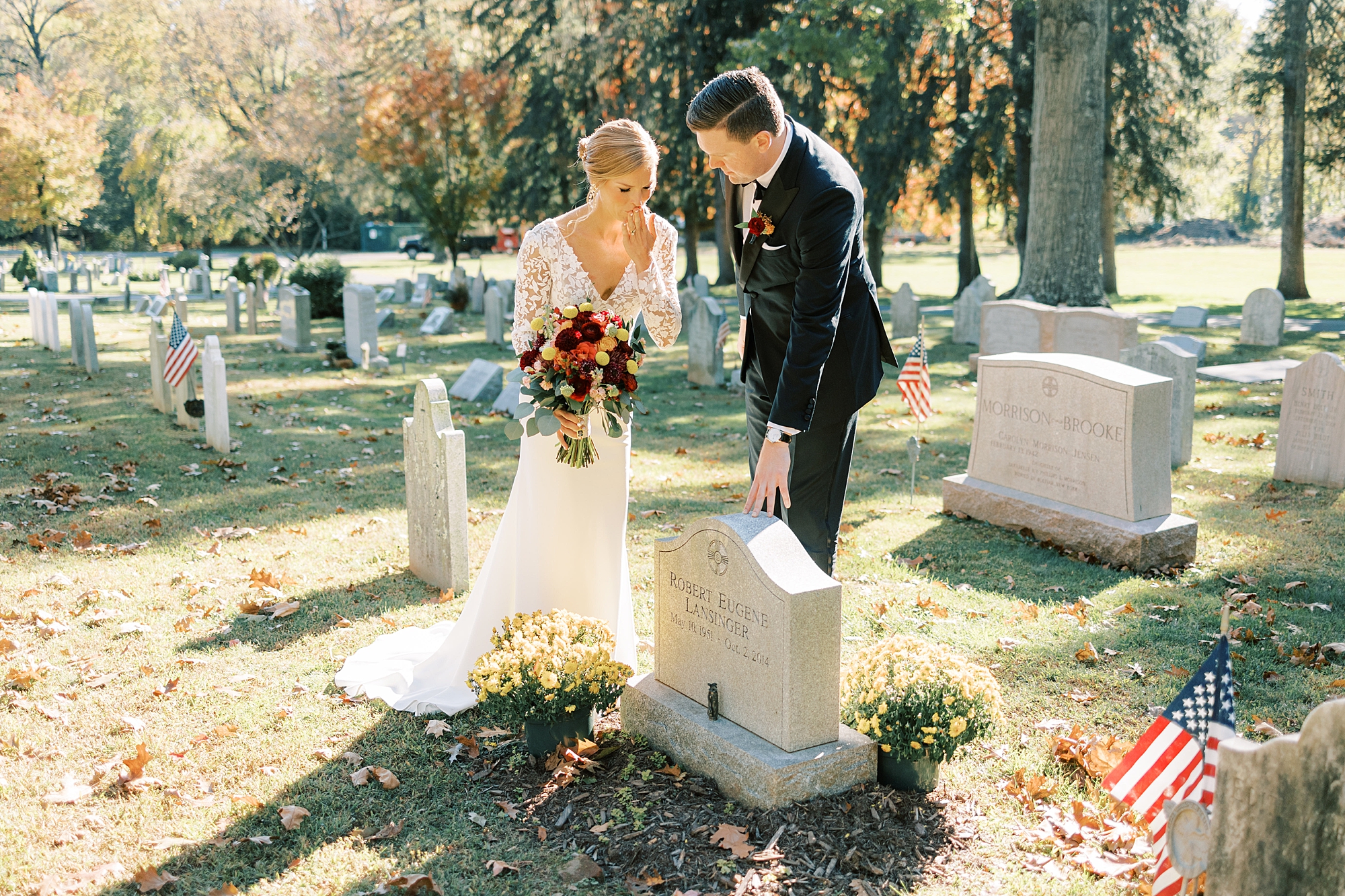 bride and groom talk to father's headstone at St. David’s Episcopal Church 