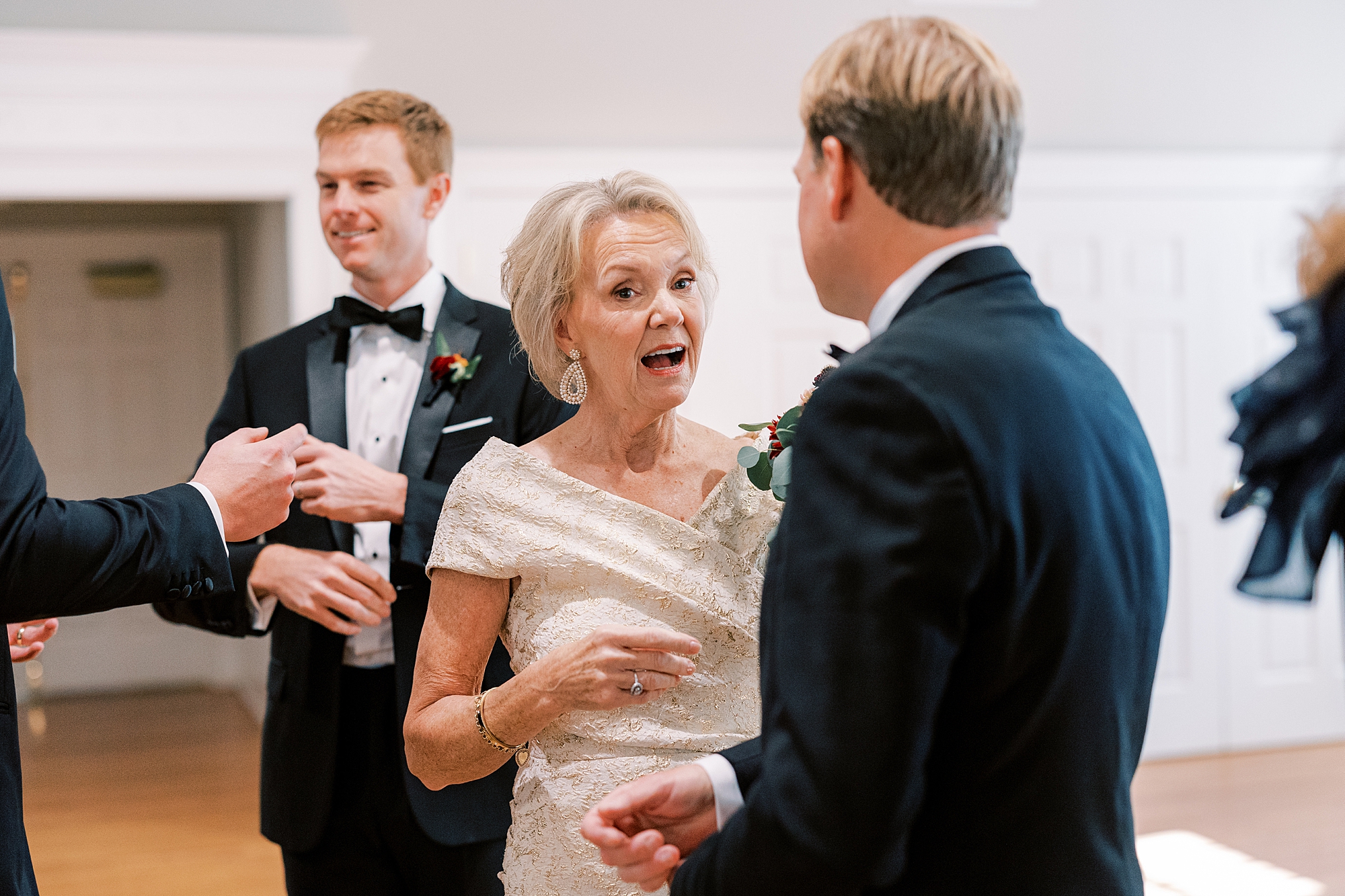 mother talks to wedding guests inside St. David’s Episcopal Church 